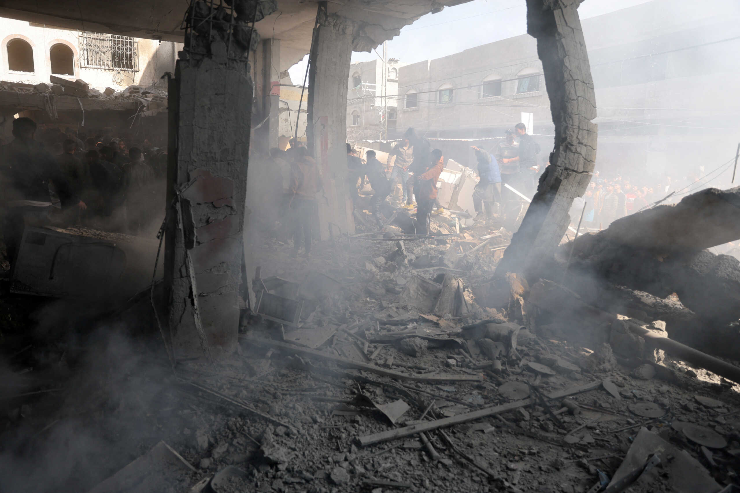 Palestinians inspect the site of an Israeli strike on a house, amid the ongoing conflict between Israel and Hamas, in Rafah, in the southern Gaza Strip February 24, 2024. REUTERS