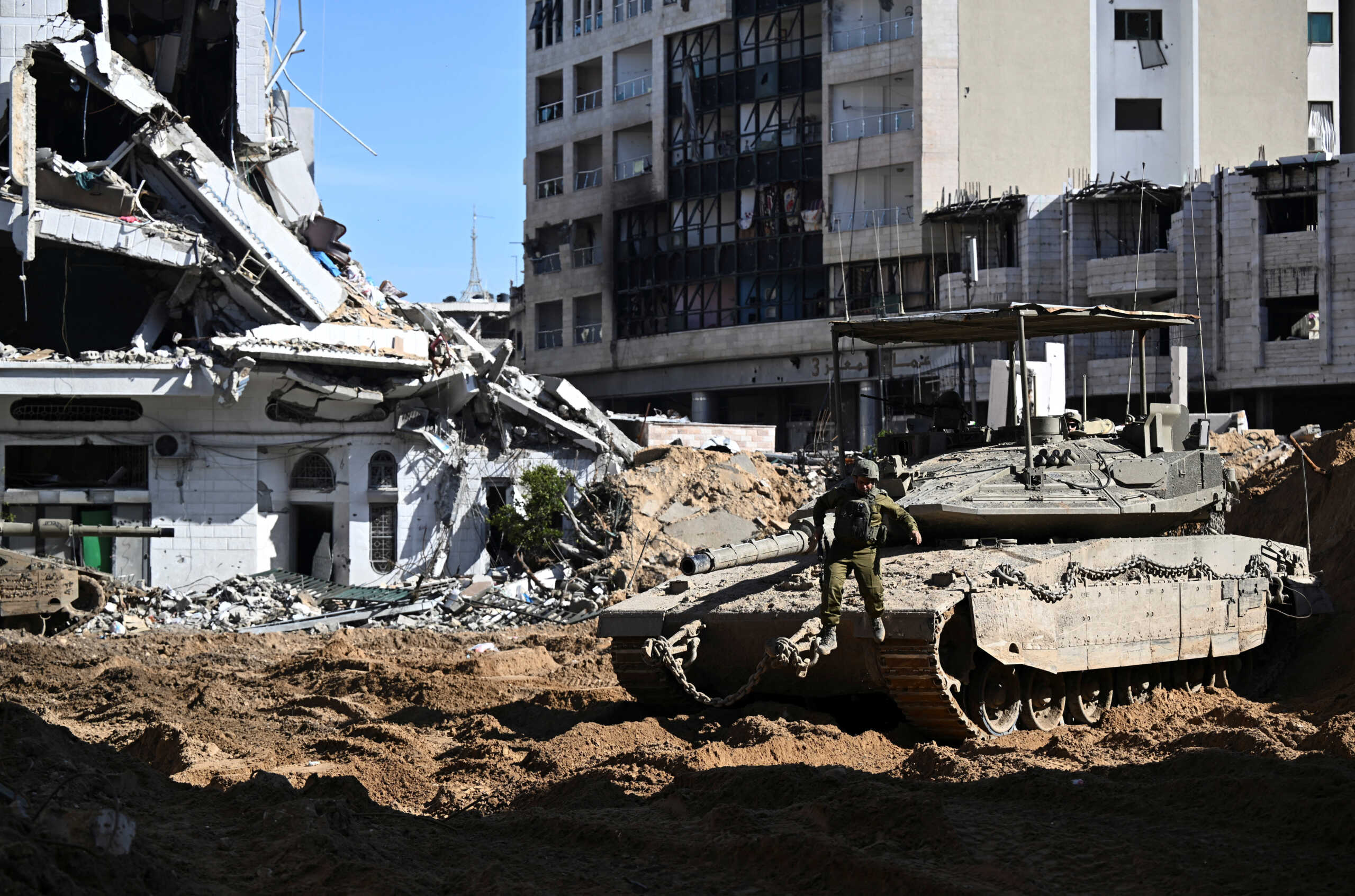 An Israeli soldier jumps from a tank, amid the ongoing conflict between Israel and the Palestinian Islamist group Hamas, in the Gaza Strip, February 8, 2024. REUTERS