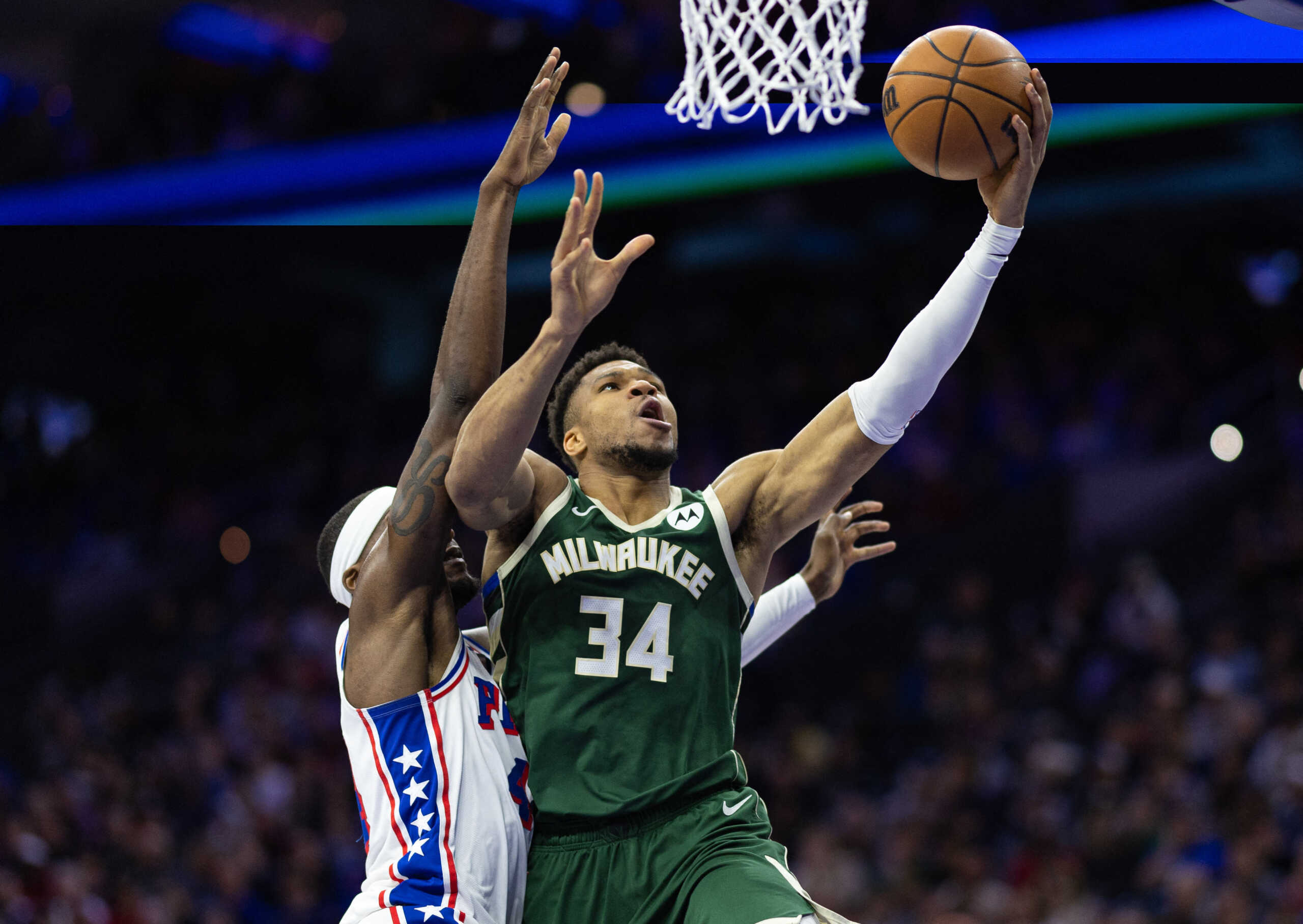 Feb 25, 2024; Philadelphia, Pennsylvania, USA; Milwaukee Bucks forward Giannis Antetokounmpo (34) drives for a score past Philadelphia 76ers forward Paul Reed (44) during the second quarter at Wells Fargo Center. Mandatory Credit: Bill Streicher-USA TODAY Sports