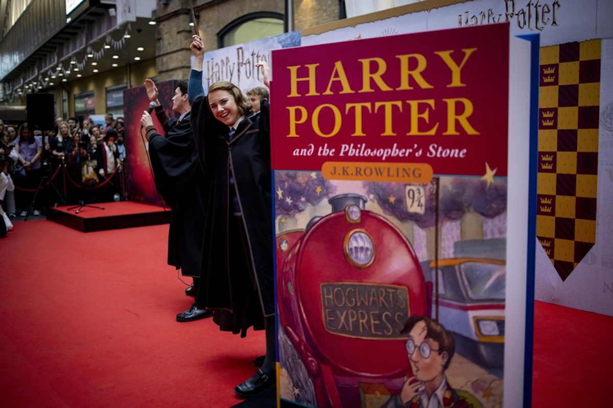epa10152058 The cast of 'Harry Potter and The Cursed Child' perform for Harry Potter fans that gathered to celebrate the 25th anniversary of the first Harry Potter book's release at King's Cross station in London, Britain, 01 September 2022. The 'Back to Hogwarts' event also celebrates the 25th anniversary of the departure of the Hogwarts Express Platform Nine and Three Quarters depicted in 'Harry Potter and the Philosopher's Stone'. In the last 25 years J.K. Rowling's series has sold over 600 million copies worldwide, has been translated into more than 80 languages and turned into 8 films.  EPA