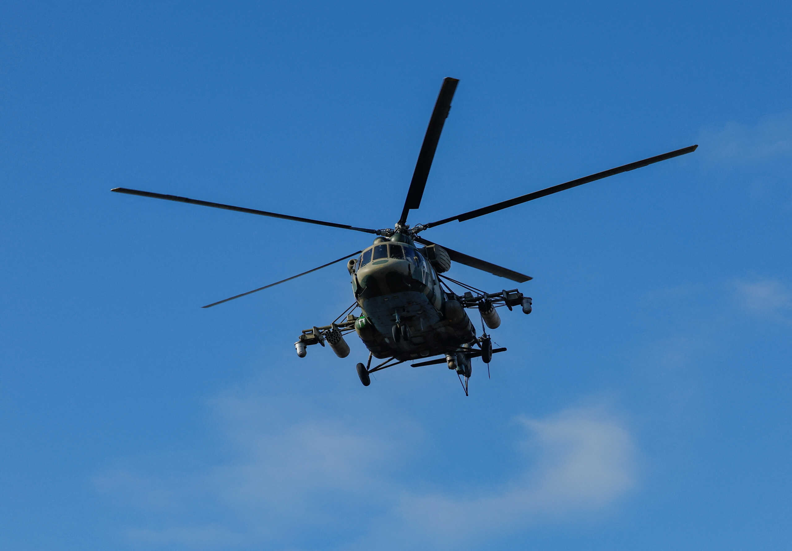 A Russian Mi-17 military helicopter flies over the settlement of Panteleimonivka in the course of Russia-Ukraine conflict in the Donetsk region, Russian-controlled Ukraine, February 17, 2024. REUTERS