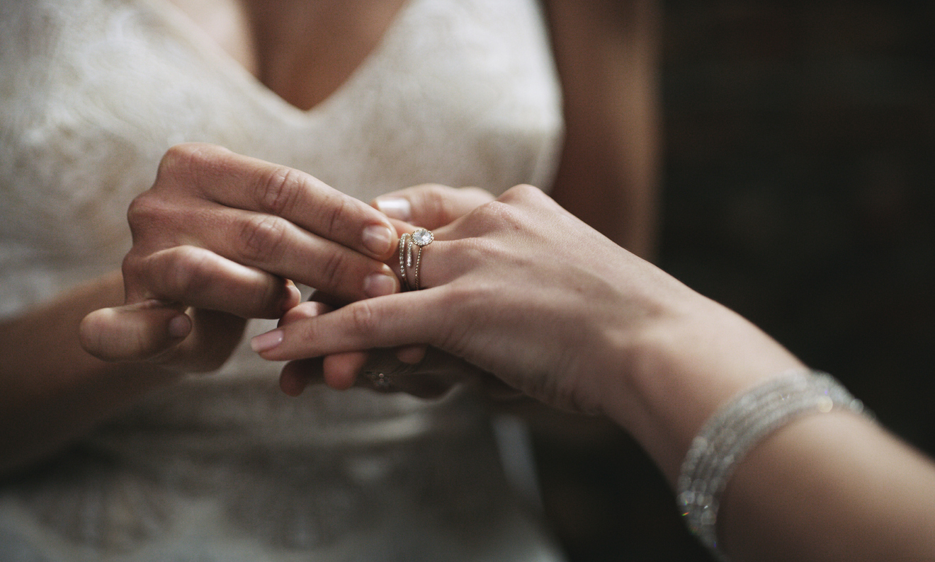 Cropped shot of two unrecognisable women exchanging rings on their wedding day