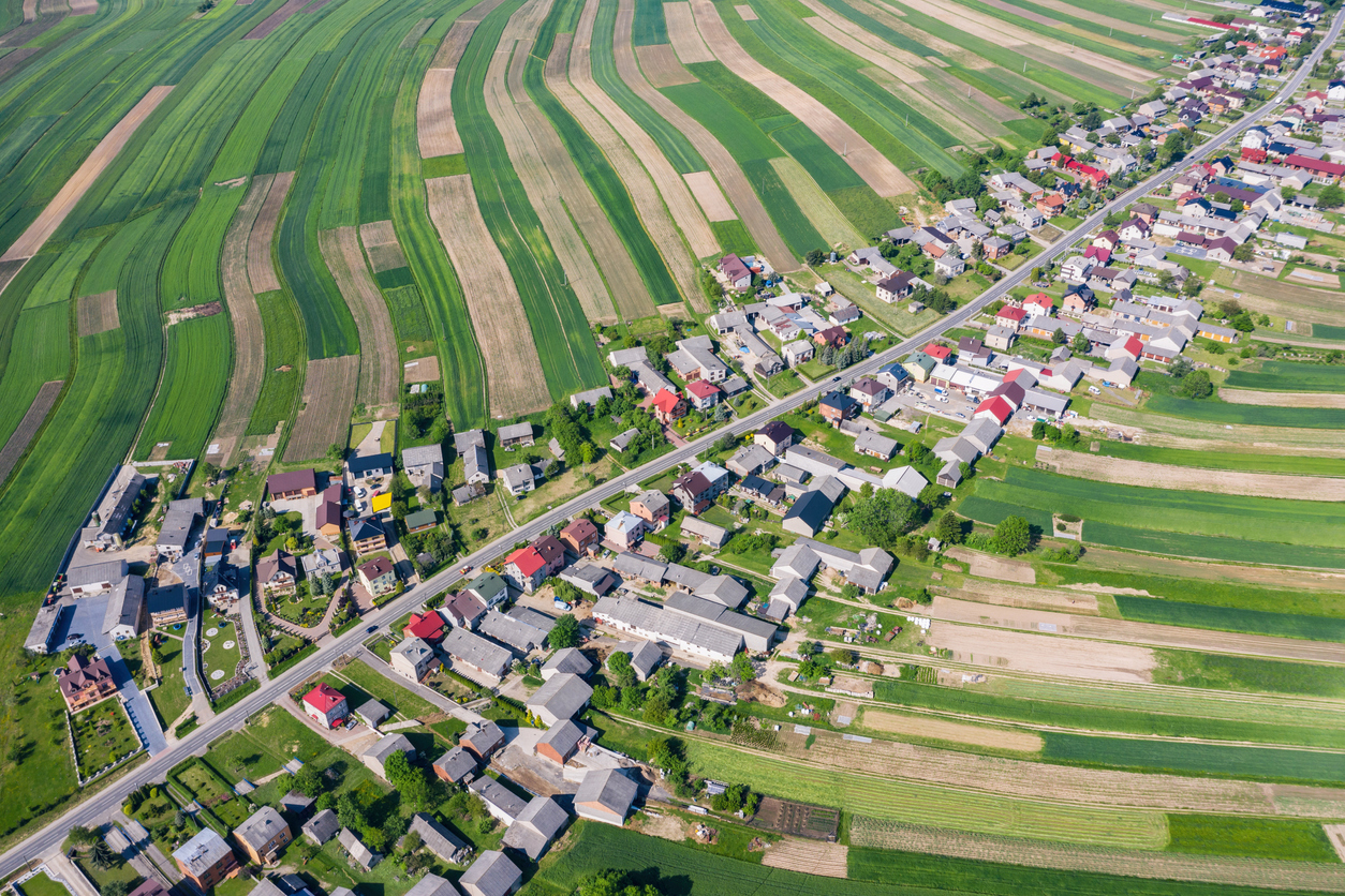 Village from drone aerial view. Suloszowa village in Krakow County, Lesser Poland Voivodeship, in southern Poland. Beautiful village with houses and fields in Poland. Village in the middle of the fields