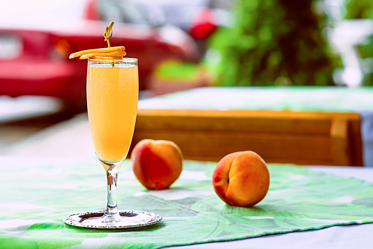 Bellini cocktail standing on the table at bar's terrace outdoor in the downtown