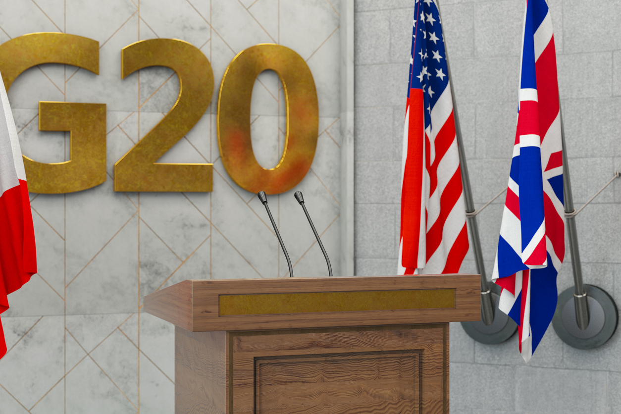 G20 Summit Press Conference or Parliament Speech Concept with Country Flags. 3D Render