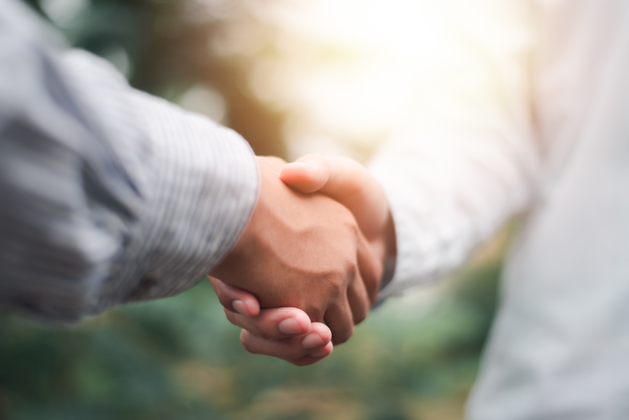 Businessmen shaking hands to indicate a business deal,successful contract management of the company,signing an agreement,business partner,New opportunities for the future of the industry,joint venture