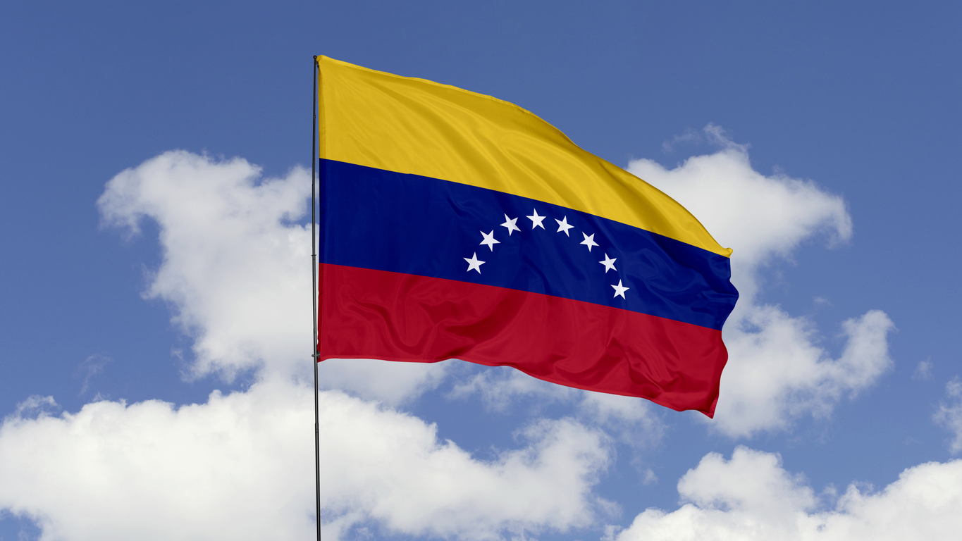 3d illustration flag of Venezuela. Venezuela flag isolated on the blue sky.