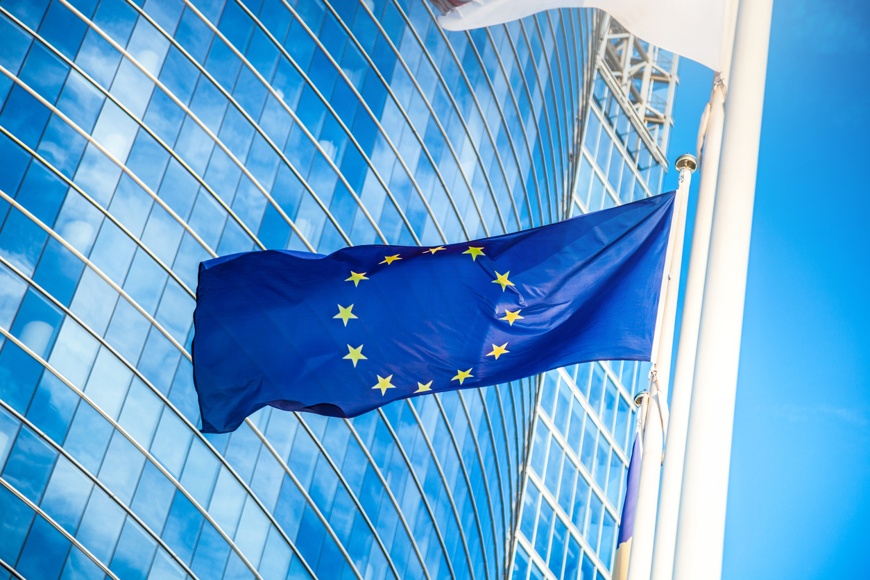 European flag against skyscraper in financial district.