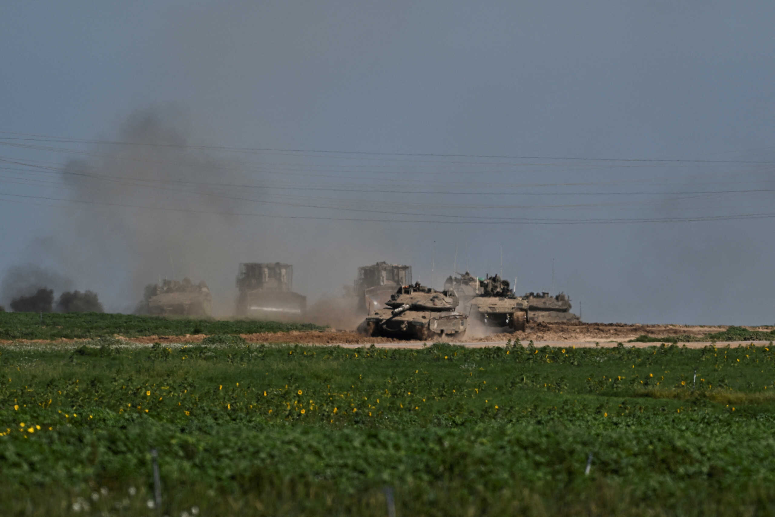 Military vehicles patrol near the Israel-Gaza border, amid the ongoing conflict between Israel and the Palestinian Islamist group Hamas, as seen from Israel, February 11, 2024. REUTERS