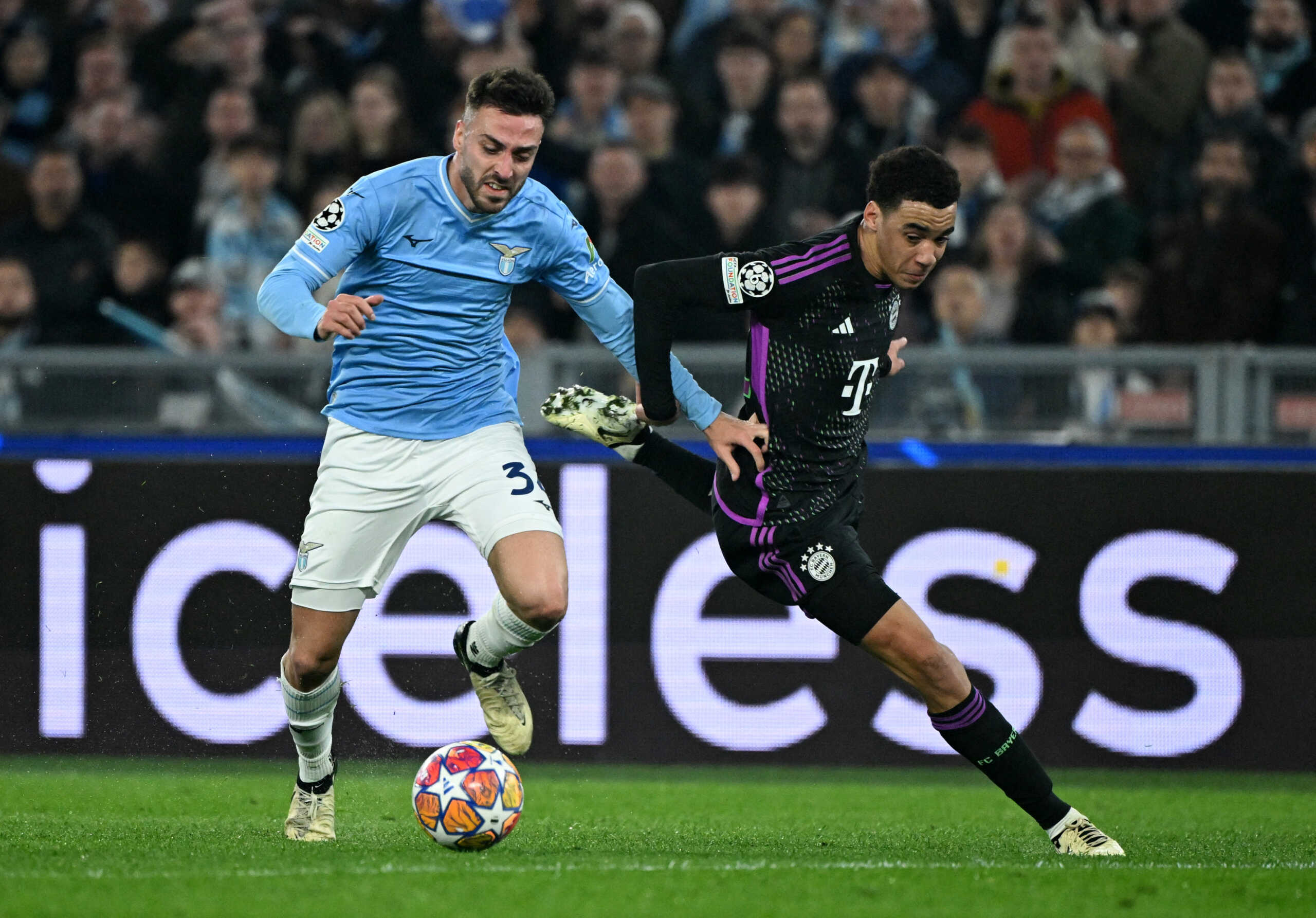 Soccer Football - Champions League - Lazio v Bayern Munich - Stadio Olimpico, Rome, Italy - February 14, 2024 Lazio's Mario Gilaia Bayern Munich's Jamal Musiala REUTERS