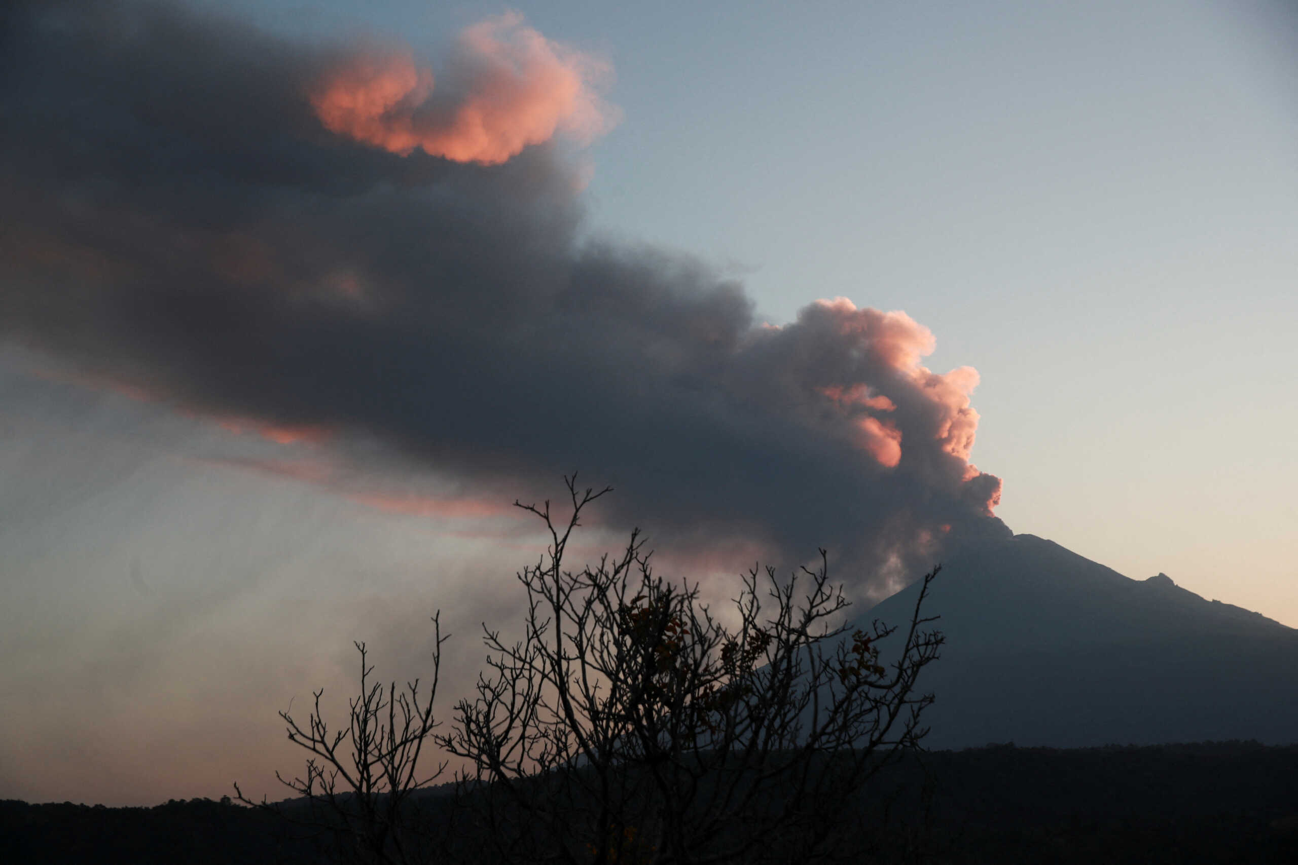 Popocatepetl volcano spews a column of ash and smoke as authorities declare a yellow alert after an increase in volcanic activity, as seen from Santiago Xalitzintla, in the state of Puebla, Mexico, February 22, 2024. REUTERS