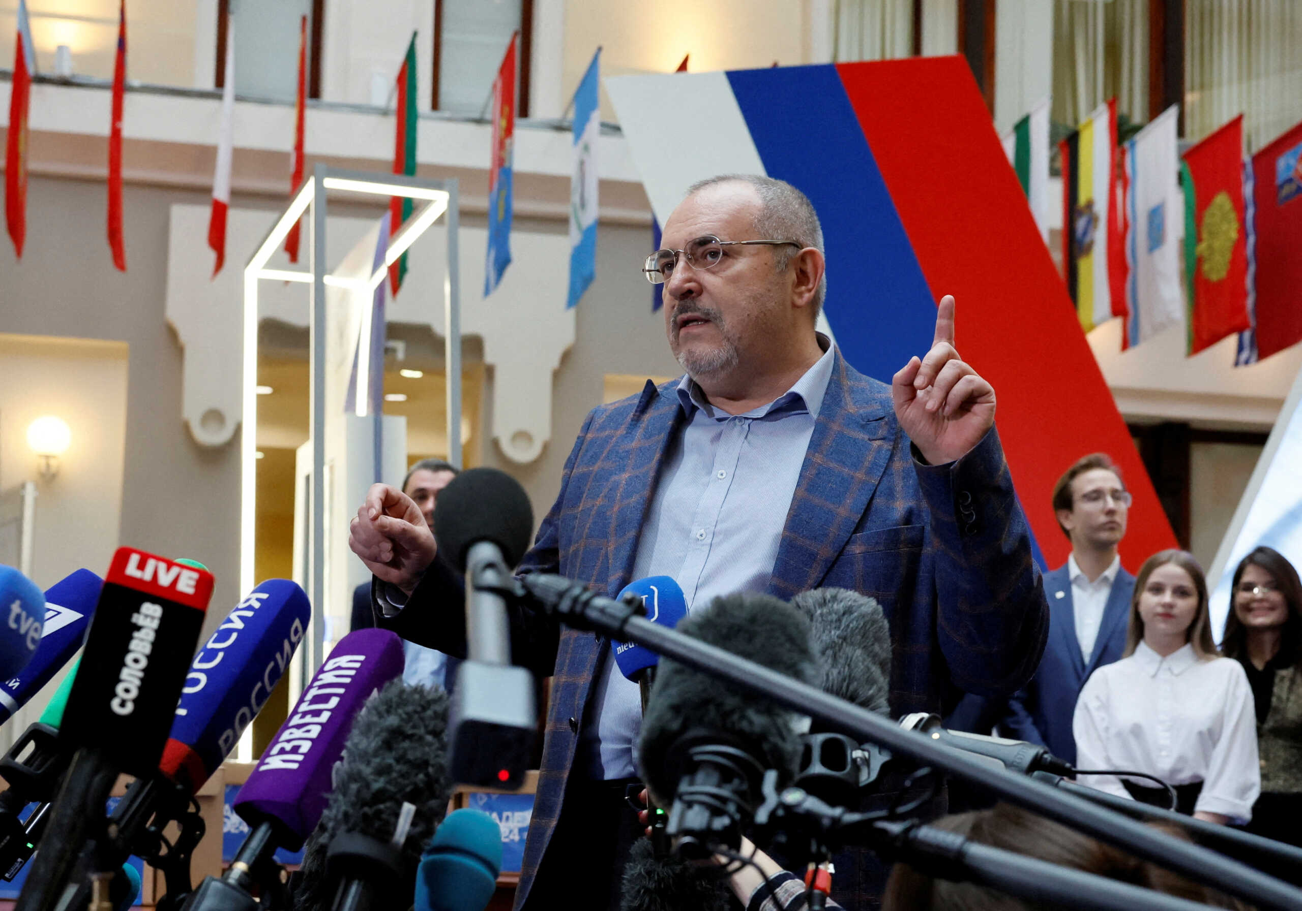 FILE PHOTO: Boris Nadezhdin, a representative of Civil Initiative political party who plans to run for Russian president in the March 2024 election, talks to journalists as he visits an office of the Central Election Commission to submit documents and signatures in support of his candidacy, in Moscow, Russia January 31, 2024. REUTERS