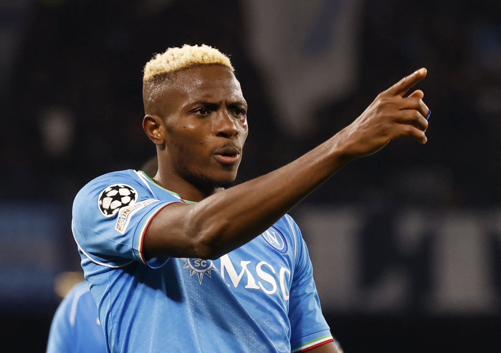 Soccer Football - Champions League - Round of 16 - First Leg - Napoli v FC Barcelona - Stadio Diego Armando Maradona, Naples, Italy - February 21, 2024 Napoli's Victor Osimhen celebrates scoring their first goal REUTERS