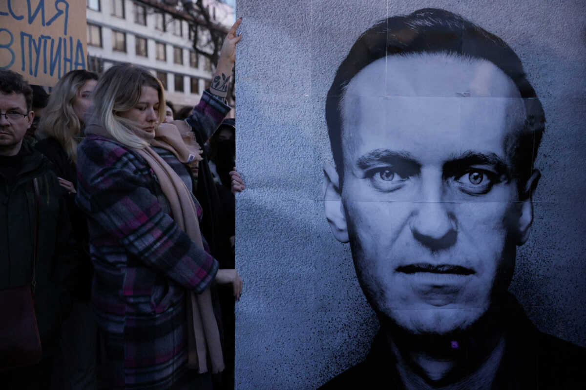 People gather outside the Russian embassy, following the death of Russian opposition leader Alexei Navalny, reported by prison authorities in Russia's Yamalo-Nenets region where he had been serving his sentence, in Warsaw, Poland, February 16, 2024. Dawid Zuchowicz