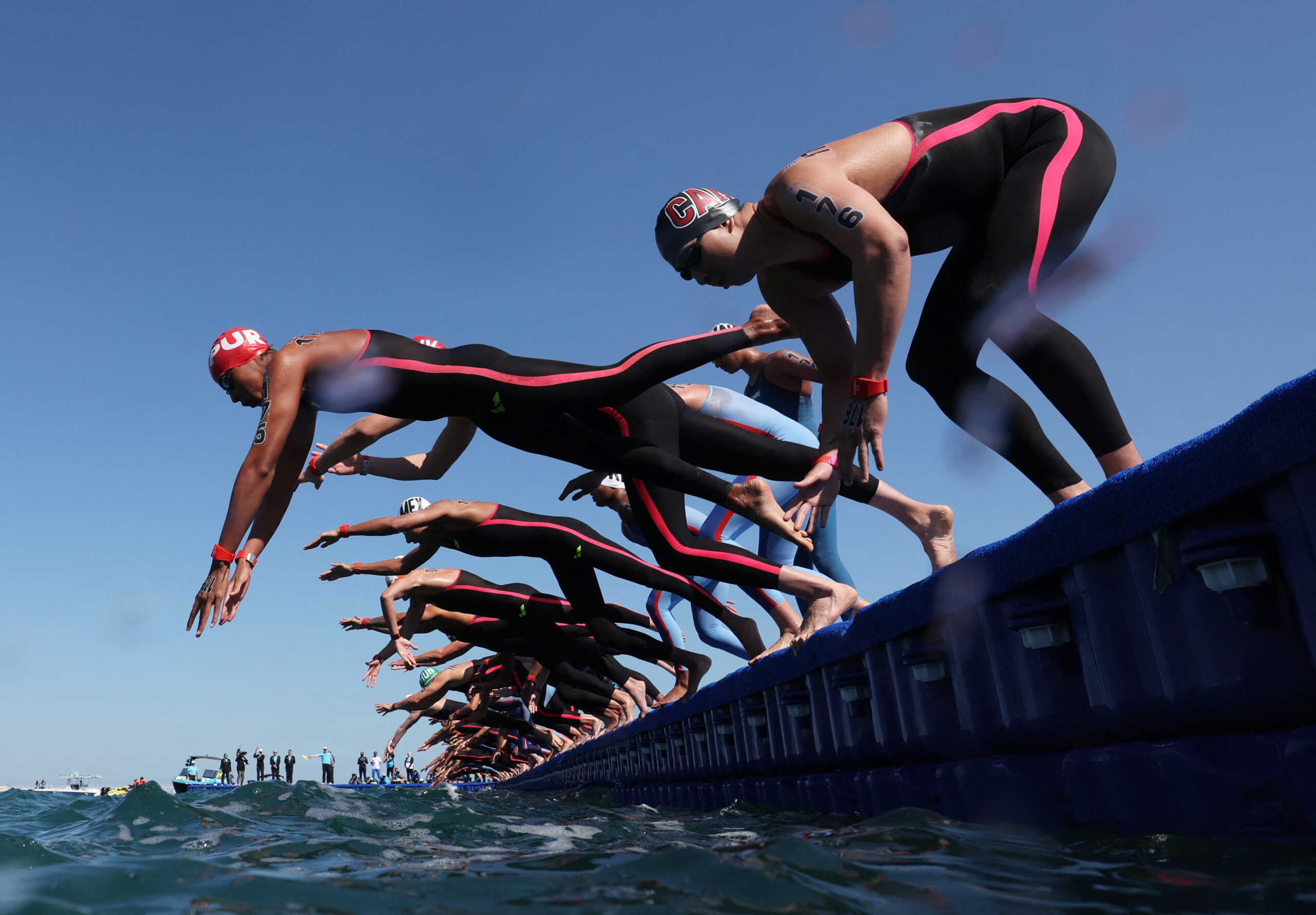 Open Water Swimming - World Aquatics Championships - Old Doha Port, Doha, Qatar - February 7, 2024 General view of swimmers in action during the men's 5km final REUTERS