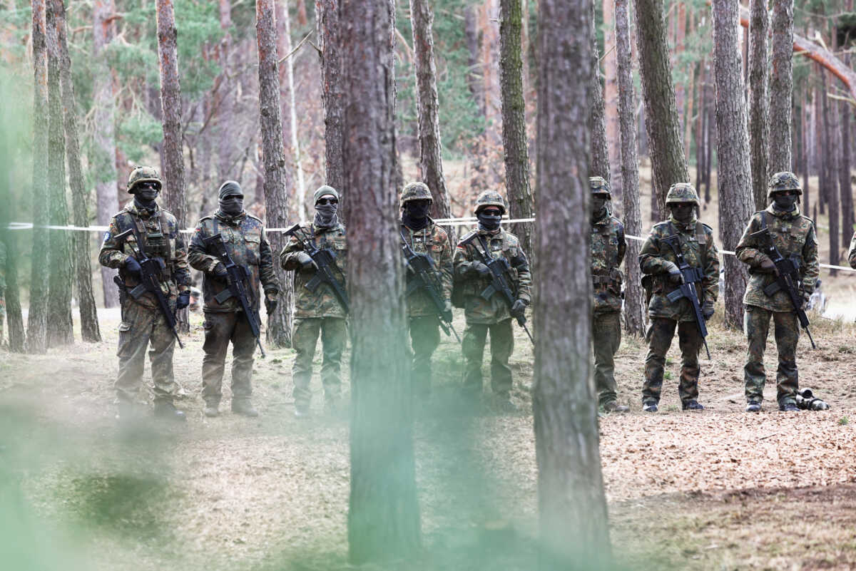 Soldiers stand in line at a training site as they undergo maintenance training on Leopard 1 A5 tanks, at the German army Bundeswehr base, part of the EU Military Assistance Mission in support of Ukraine (EUMAM UA) in Klietz, Germany, February 23, 2024. REUTERS