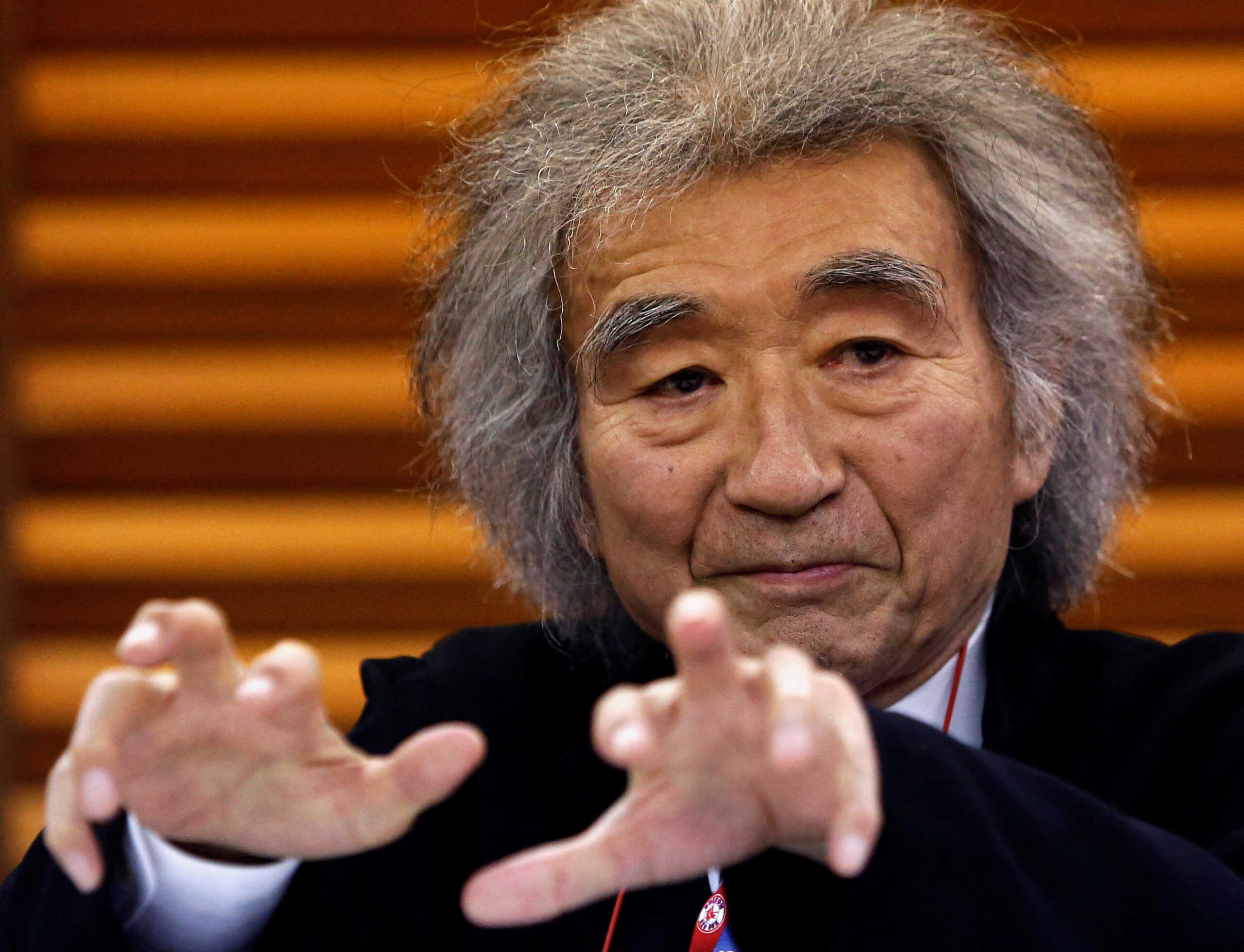 FILE PHOTO: Japan's maestro Seiji Ozawa gestures during a news conference in Tokyo December 19, 2013. REUTERS