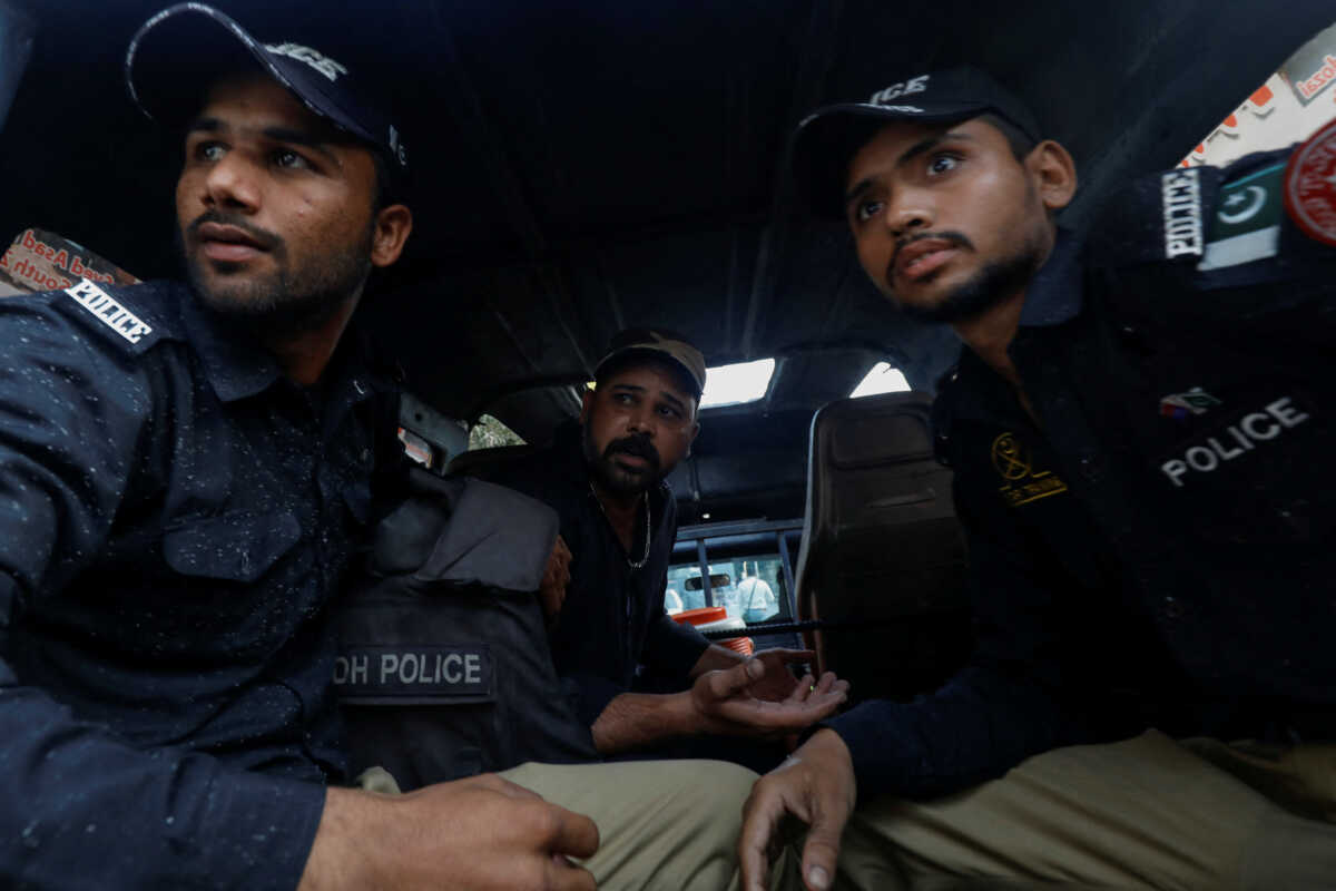 Police officers detain a supporter of former prime minister Imran Khan's party, the Pakistan Tehreek-e-Insaf (PTI), as they arrive for the pre-arrest bail hearings, outside the Sindh High Court, Karachi, Pakistan January 30, 2024. REUTERS