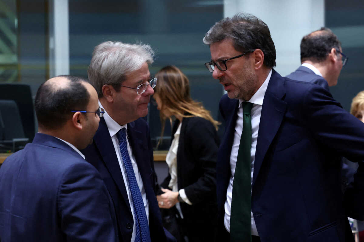 FILE PHOTO: Malta's Finance Minister Clyde Caruana, European Commissioner for Economy Paolo Gentiloni, and Italy's Finance Minister Giancarlo Giorgetti talk on the day of the Eurozone finance ministers meeting in Brussels, Belgium December 7, 2023. REUTERS