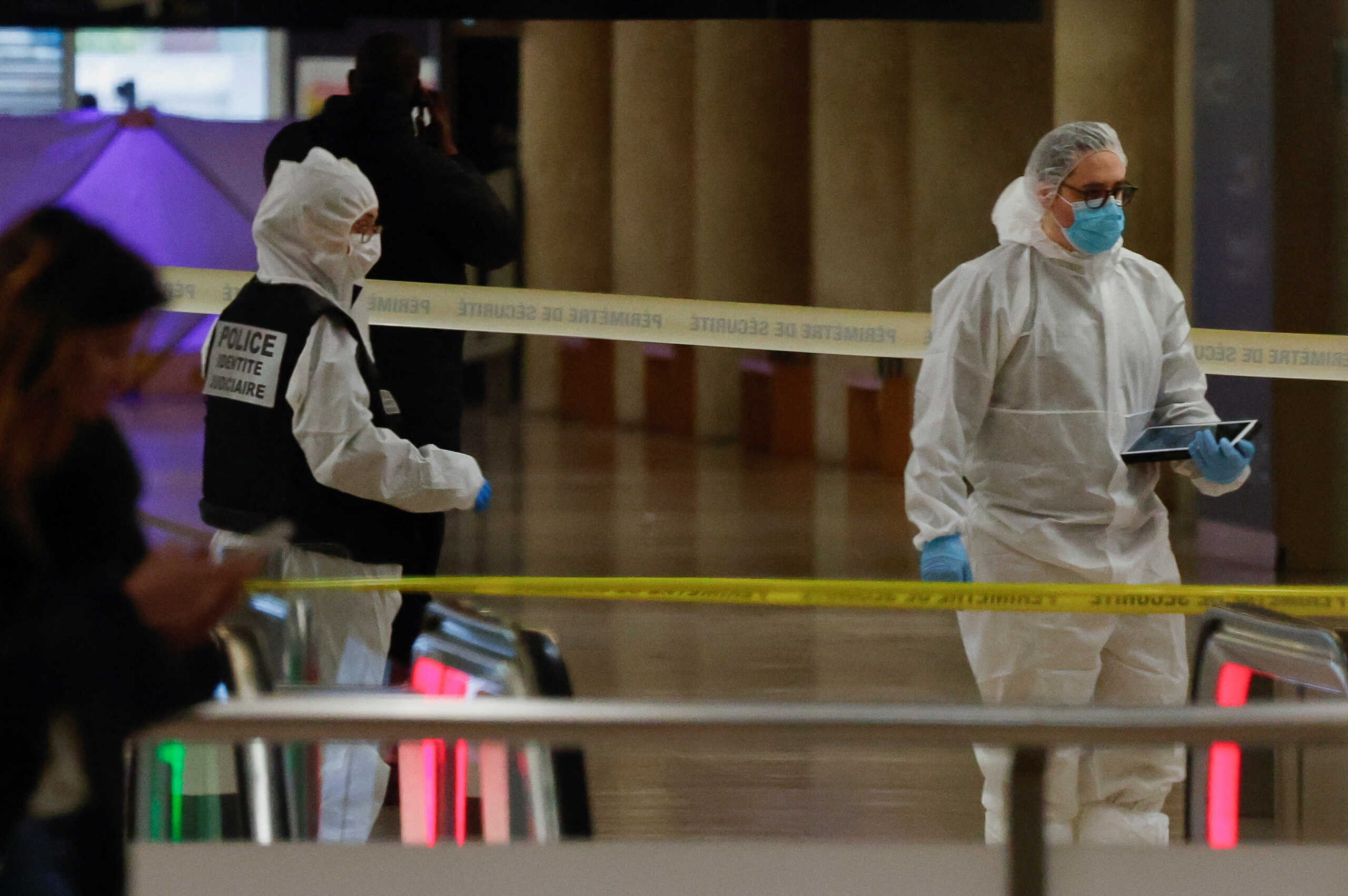 French forensic police officers work on the site after a man with a knife wounded several people at the Gare de Lyon rail station in Paris, France, February 3, 2024. REUTERS