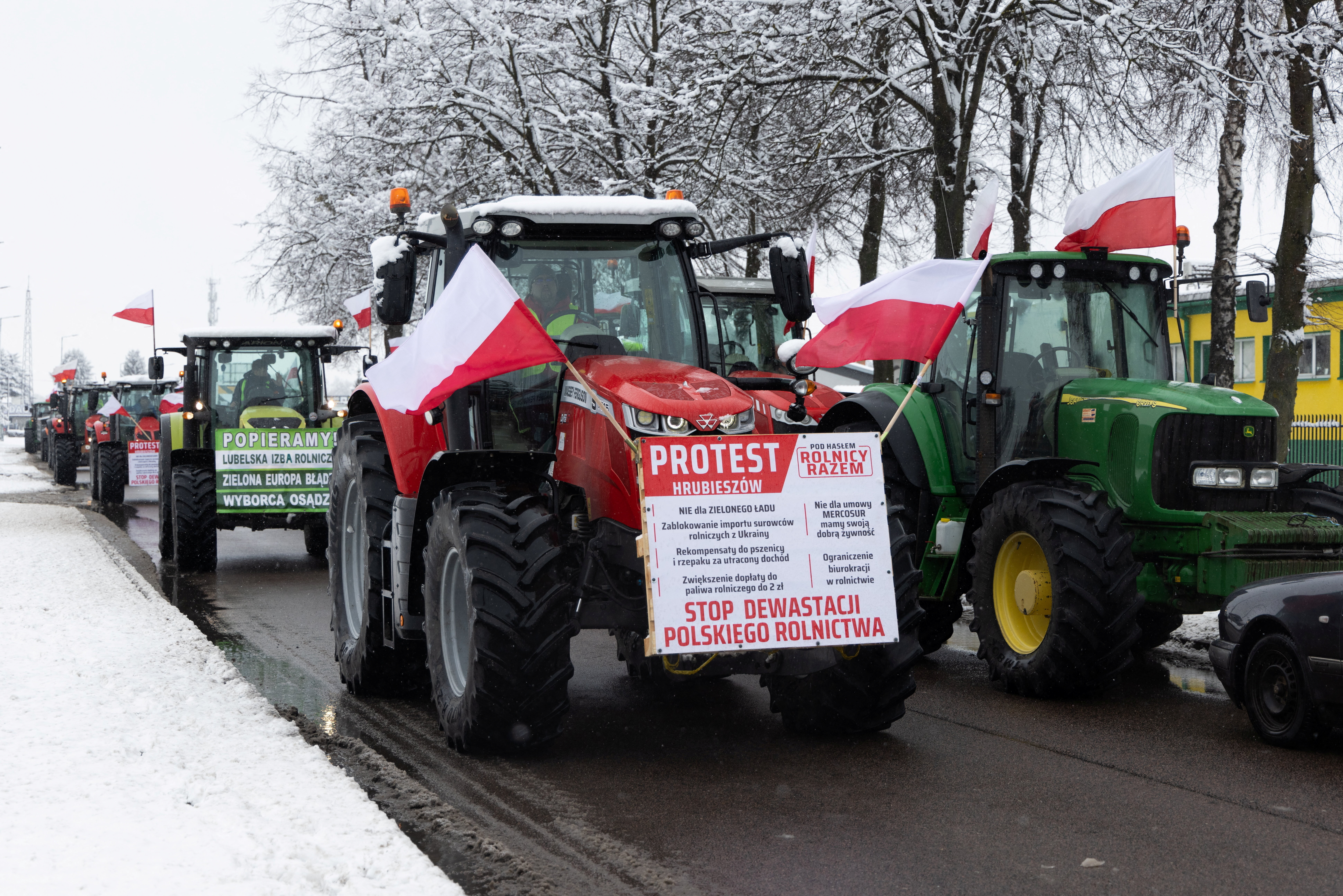 Polish farmers protest near the border with Ukraine over price pressures, taxes and green regulation, grievances shared by farmers across Europe, in Hrubieszow, Poland, February 9, 2024. Banner reads "Stop the devastation of Polish agriculture". Jakub Orzechowski