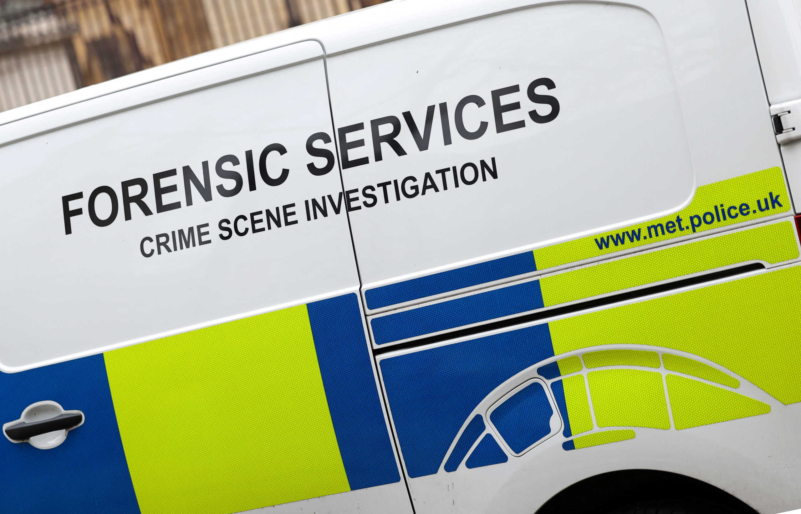 A view shows writing on the side of a Metropolitan Police forensics van in London, Britain, January 30, 2024. REUTERS