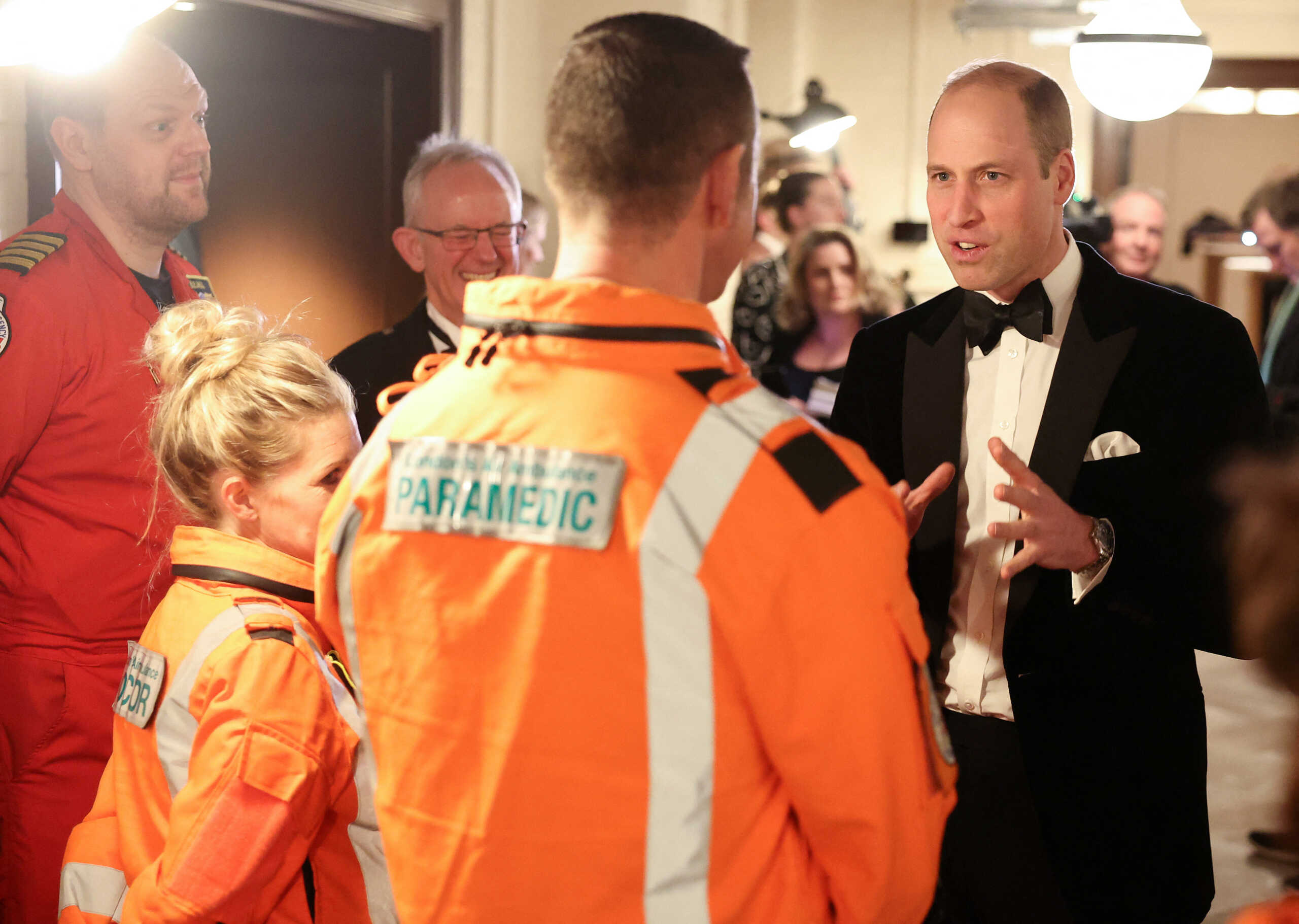 Britain's Prince William, Prince of Wales, talks with air ambulance pilots, doctors and paramedics as he attends the London Air Ambulance Charity Gala Dinner at The OWO, in central London, Britain, February 7, 2024.    Daniel Leal