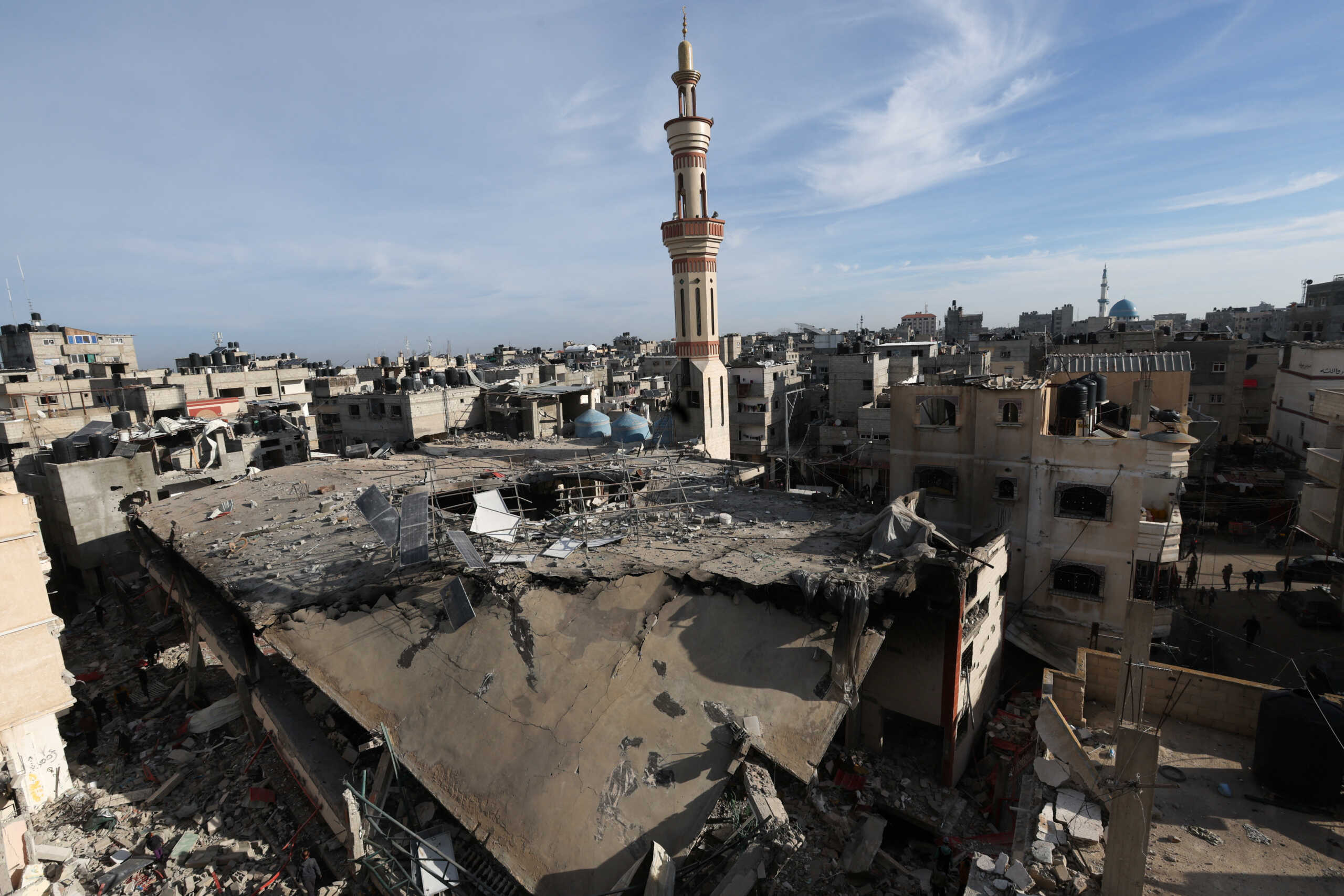 Palestinians inspect the site of an Israeli strike on a mosque, amid the ongoing conflict between Israel and the Palestinian Islamist group Hamas, in Rafah in the southern Gaza Strip, February 12, 2024. REUTERS