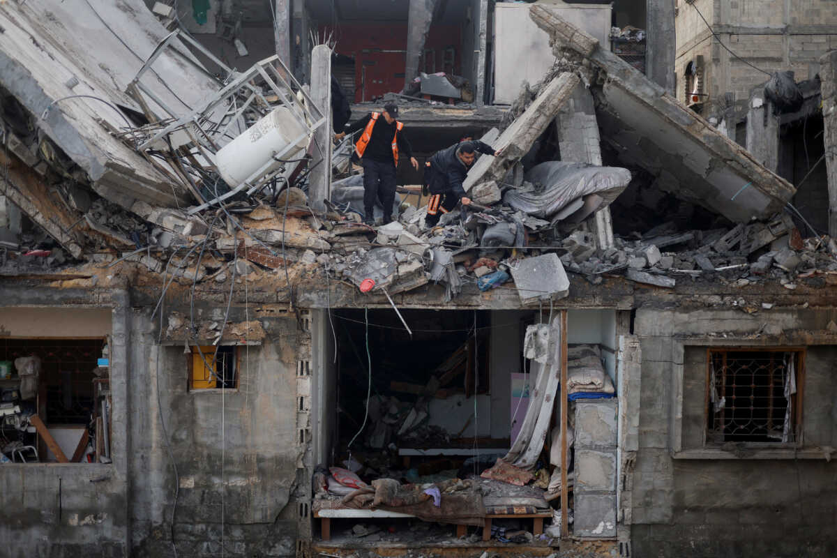 Palestinians inspect the site of an Israeli strike on a house, amid the ongoing conflict between Israel and the Palestinian Islamist group Hamas, in Rafah in the southern Gaza Strip February 27, 2024. REUTERS