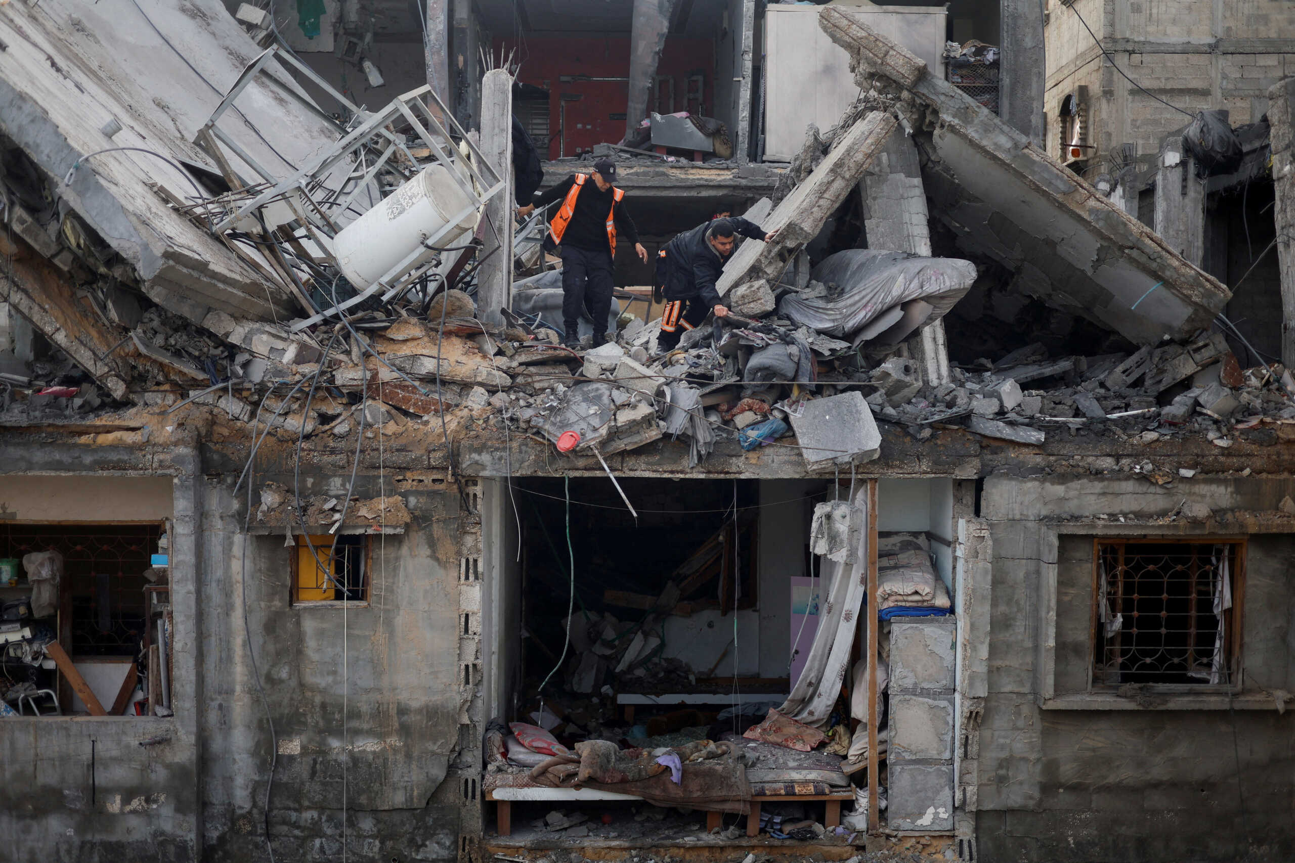 Palestinians inspect the site of an Israeli strike on a house, amid the ongoing conflict between Israel and the Palestinian Islamist group Hamas, in Rafah in the southern Gaza Strip February 27, 2024. REUTERS