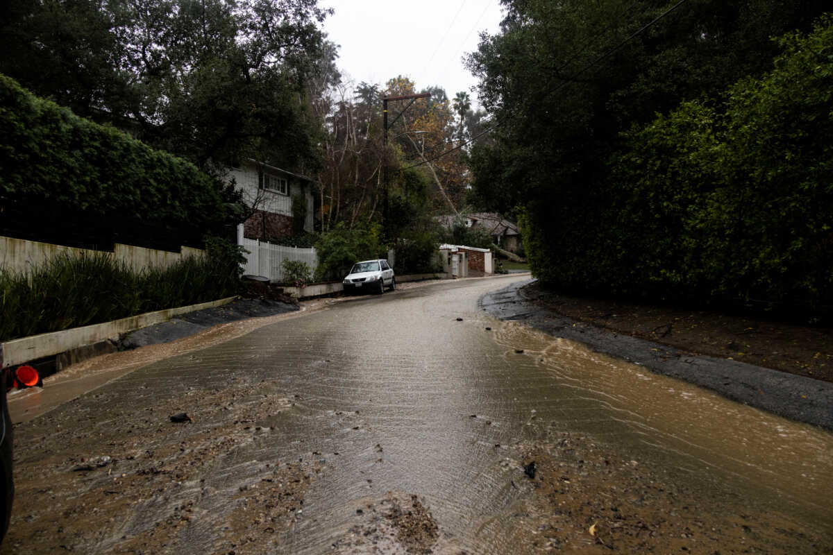 Water and mud run through a street during a rain storm in Studio City, California, U.S., February 5, 2024.  REUTERS