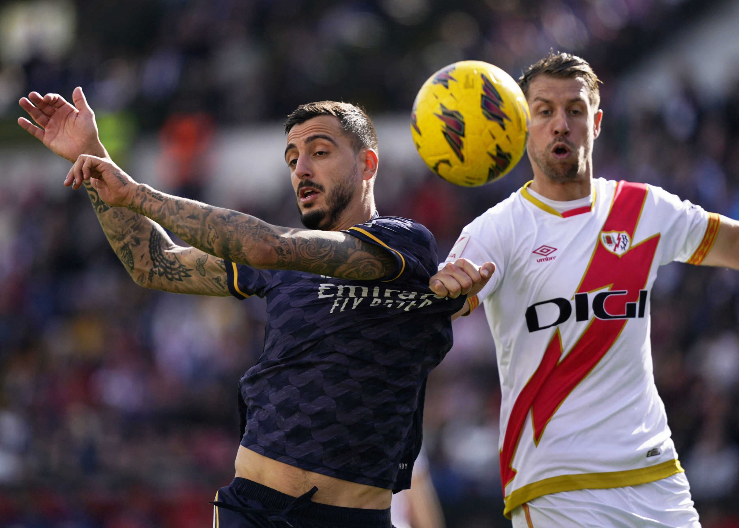 Soccer Football - LaLiga - Rayo Vallecano v Real Madrid - Campo de Futbol de Vallecas, Madrid, Spain - February 18, 2024 Real Madrid's Joselu in action with Rayo Vallecano's Florian Lejeune REUTERS