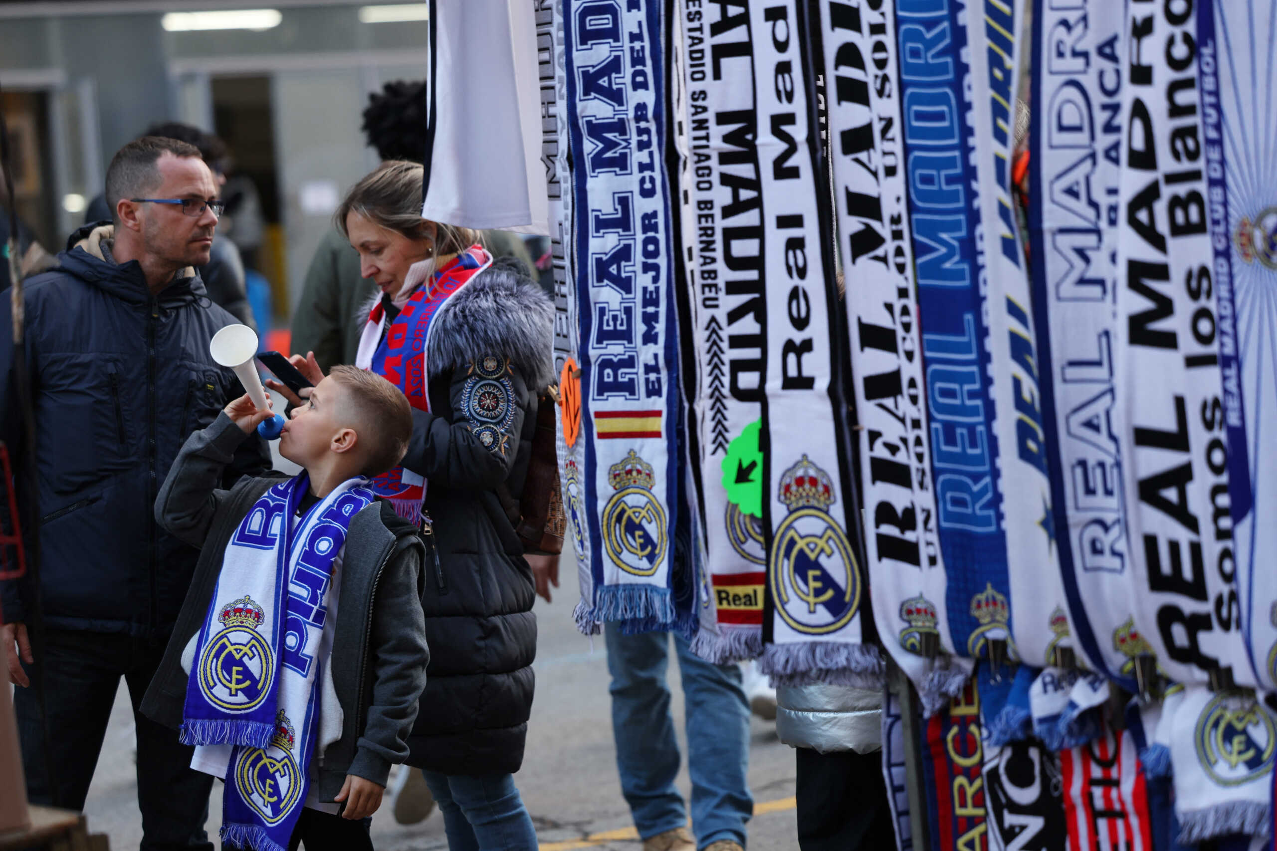 Soccer Football - LaLiga - Real Madrid v Girona - Santiago Bernabeu, Madrid, Spain - February 10, 2024 Real Madrid fans at a merchandise kiosk outside the stadium before the match REUTERS