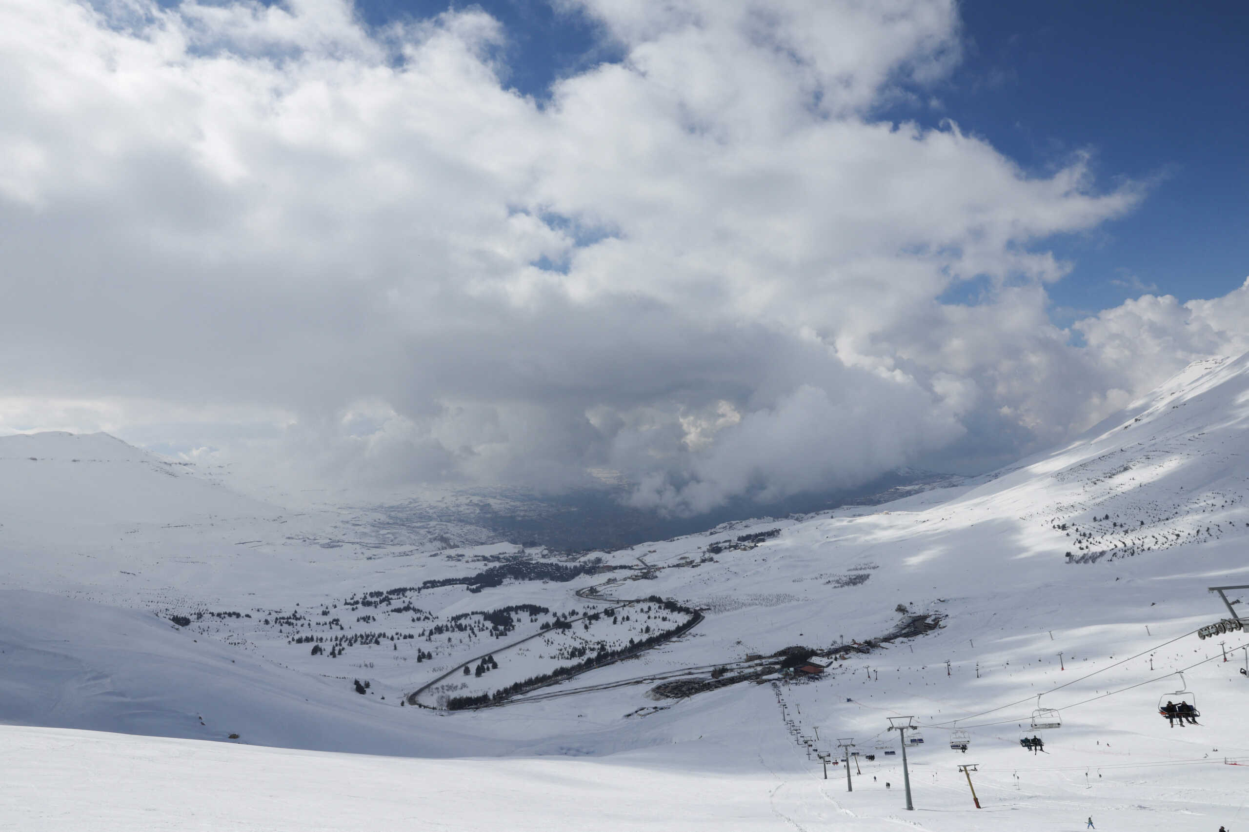 A view shows people sitting on chairlifts at a ski resort in Bcharre, Lebanon February 10, 2024. REUTERS