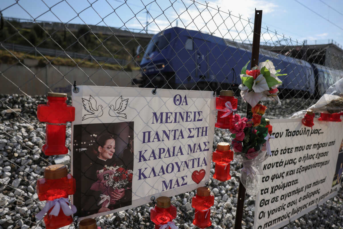 Photos of victims and banners hang at the site of Greece's deadliest train crash, in Tempi, Greece, February 24, 2024. The banner reads "Our Claudia, you will always be in our hearts". REUTERS
