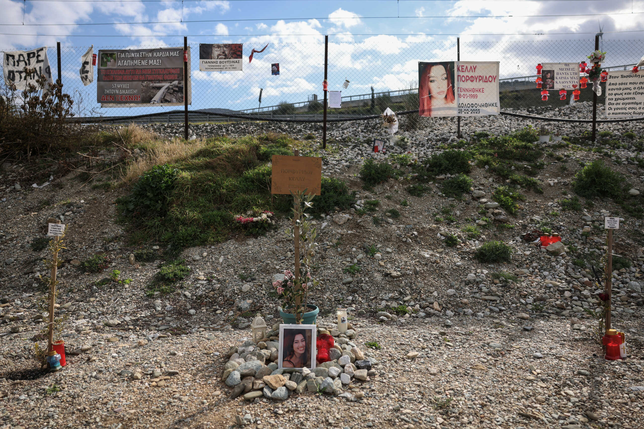 Photos of victims and banners hang at the site of Greece's deadliest train crash, in Tempi, Greece, February 24, 2024. REUTERS