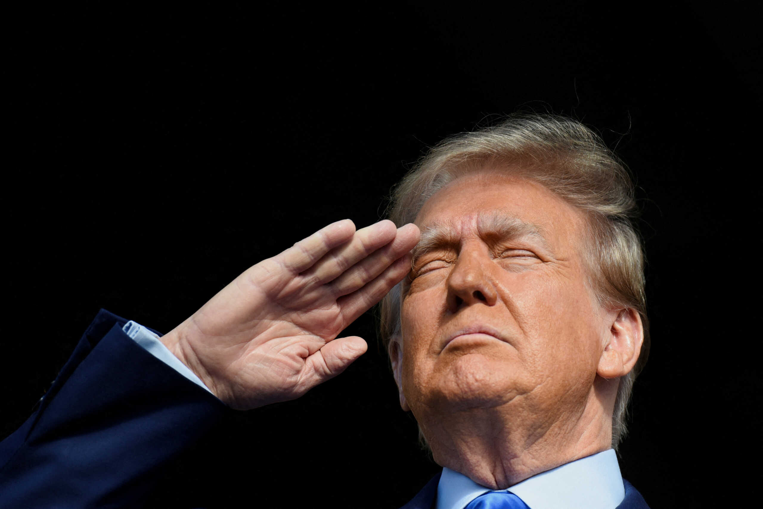 FILE PHOTO: Republican presidential candidate and former U.S. President Donald Trump salutes during the national anthem at a campaign rally in Houston, Texas., U.S. November 2, 2023. REUTERS