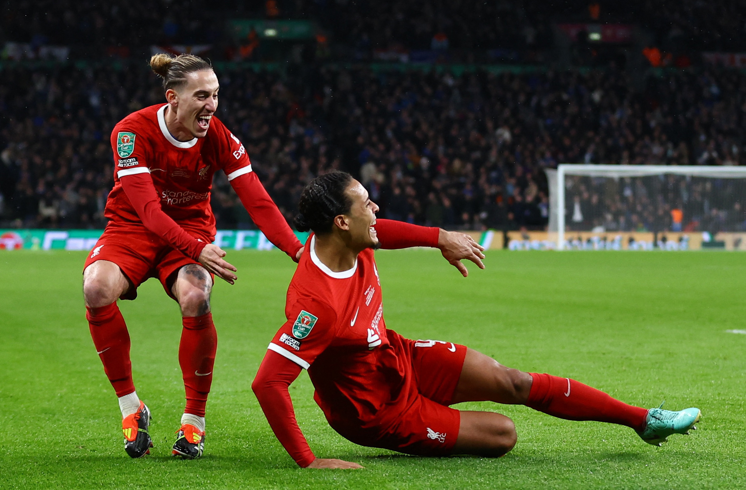 Soccer Football - Carabao Cup - Final - Chelsea v Liverpool - Wembley Stadium, London, Britain - February 25, 2024 Liverpool's Virgil van Dijk celebrates scoring their first goal with Kostas Tsimikas Action Images via Reuters