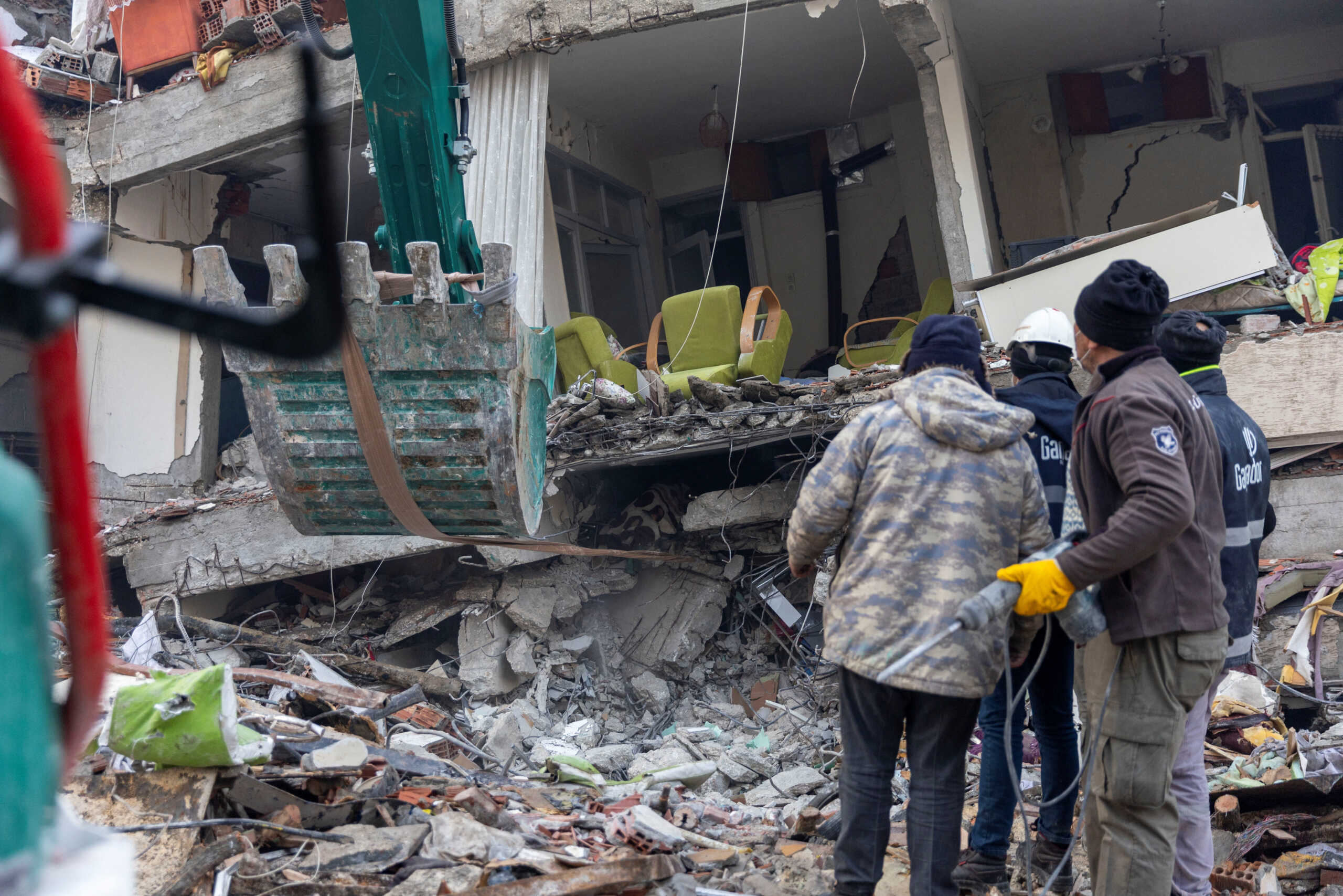 Search and rescue teams work on a site where Abdulalim Muaini (not seen) lies under the rubble, in the aftermath of a deadly earthquake in Hatay, Turkey, February 8, 2023. The deadliest disaster in Turkey's modern history, the magnitude 7.8 tremor on February 6, 2023 levelled towns and city swathes in the country's southeast and neighbouring Syria, killing more than 50,000 people and leaving millions homeless. REUTERS