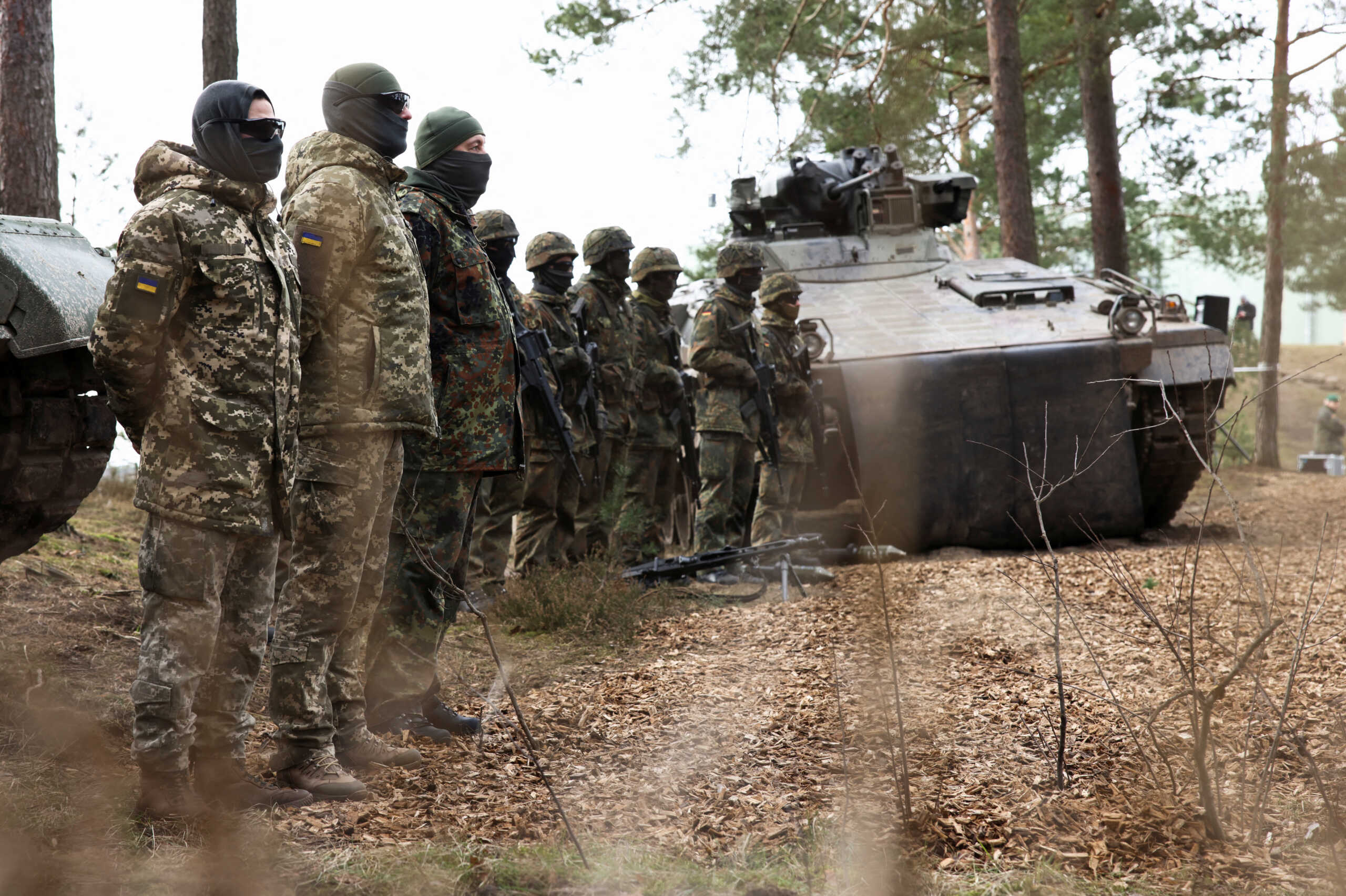 Ukrainian soldiers stand in line at a training site as they undergo maintenance training on Leopard 1 A5 tanks, at the German army Bundeswehr base, part of the EU Military Assistance Mission in support of Ukraine (EUMAM UA) in Klietz, Germany, February 23, 2024. REUTERS