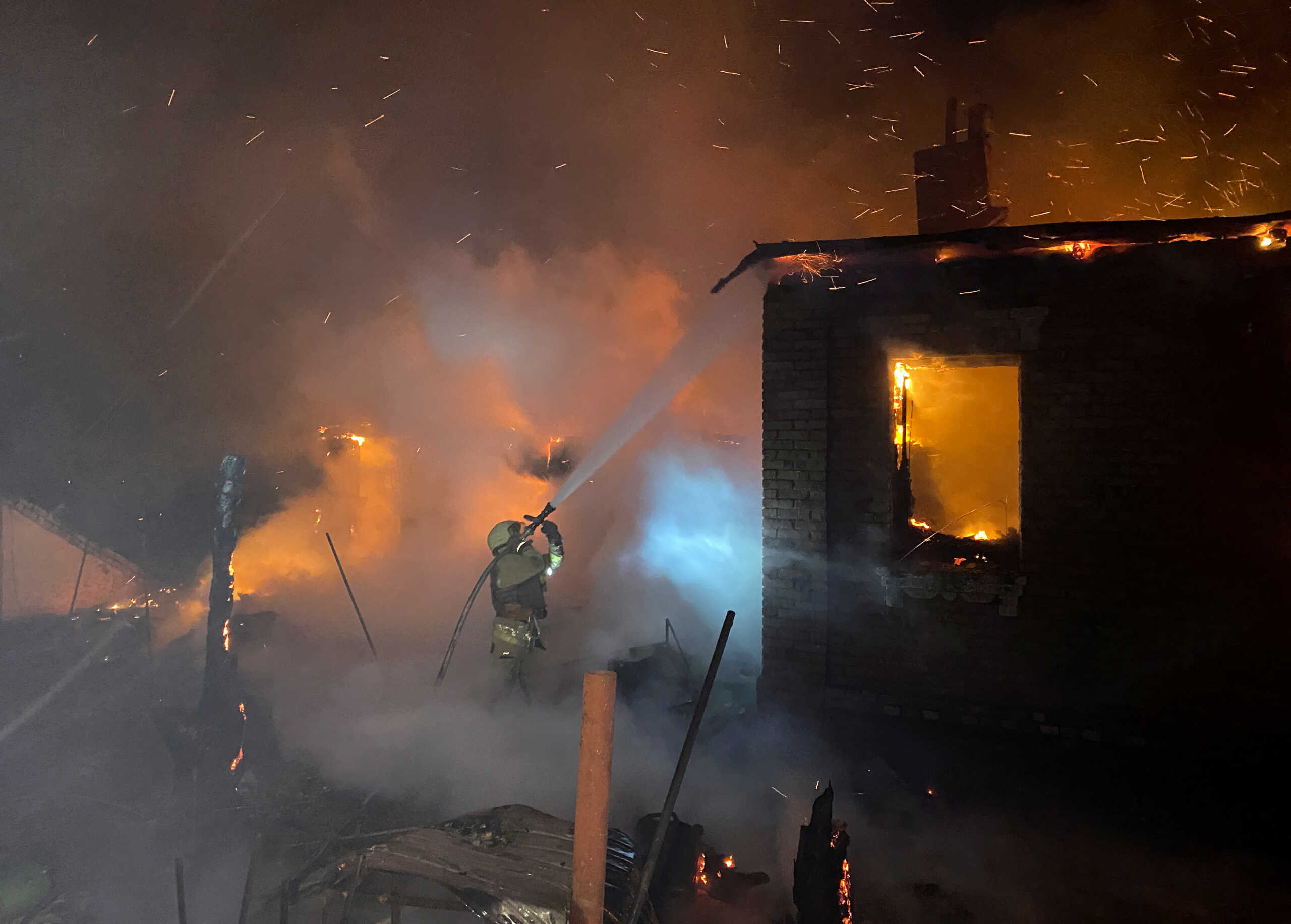 Firefighter works at a site of a Russian drone strike, amid Russia's attack on Ukraine, in Kharkiv, Ukraine February 10, 2024. REUTERS