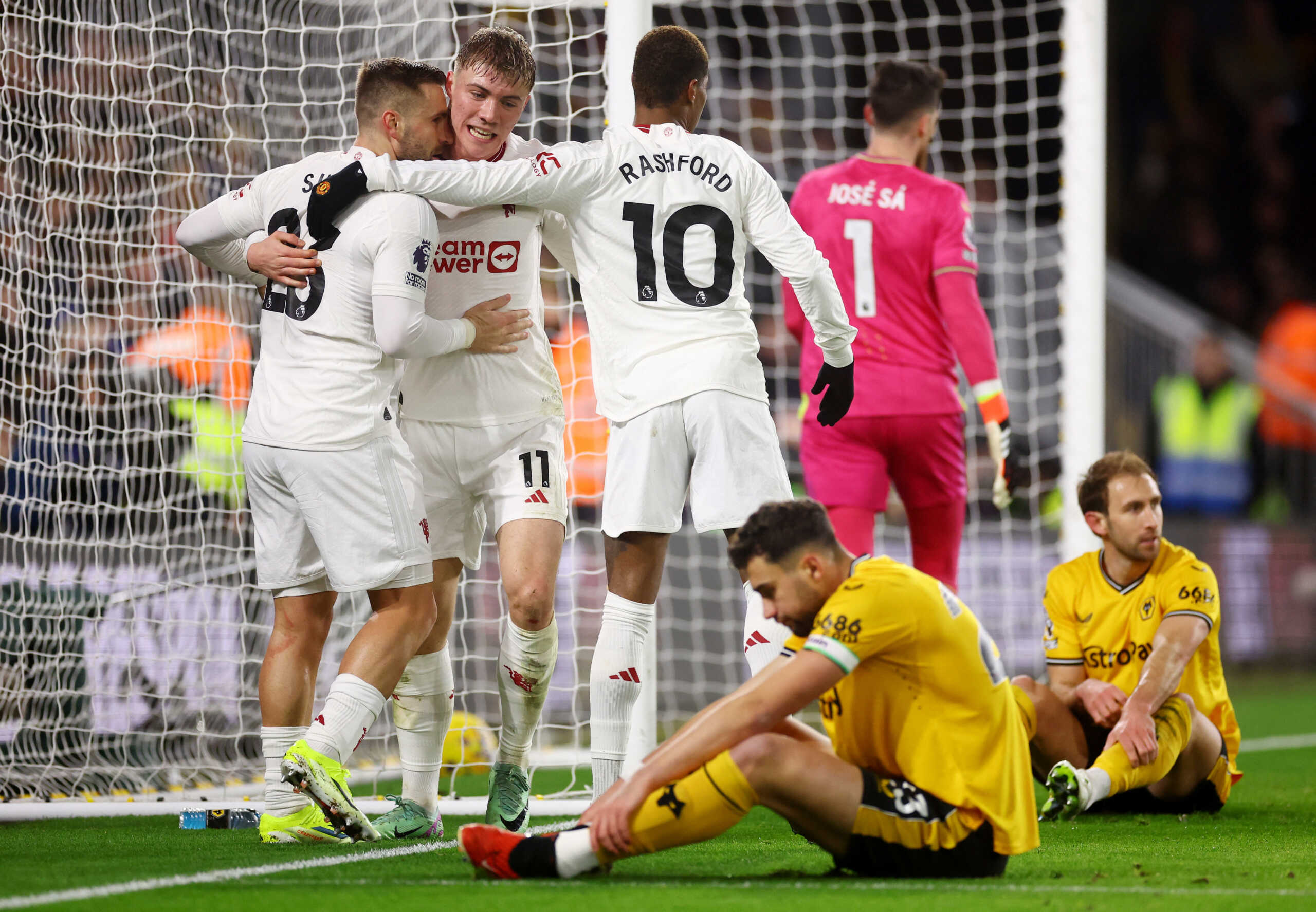 Soccer Football - Premier League - Wolverhampton Wanderers v Manchester United - Molineux Stadium, Wolverhampton, Britain - February 1, 2024 Manchester United's Rasmus Hojlund celebrates scoring their second goal with Luke Shaw and Marcus Rashford REUTERS