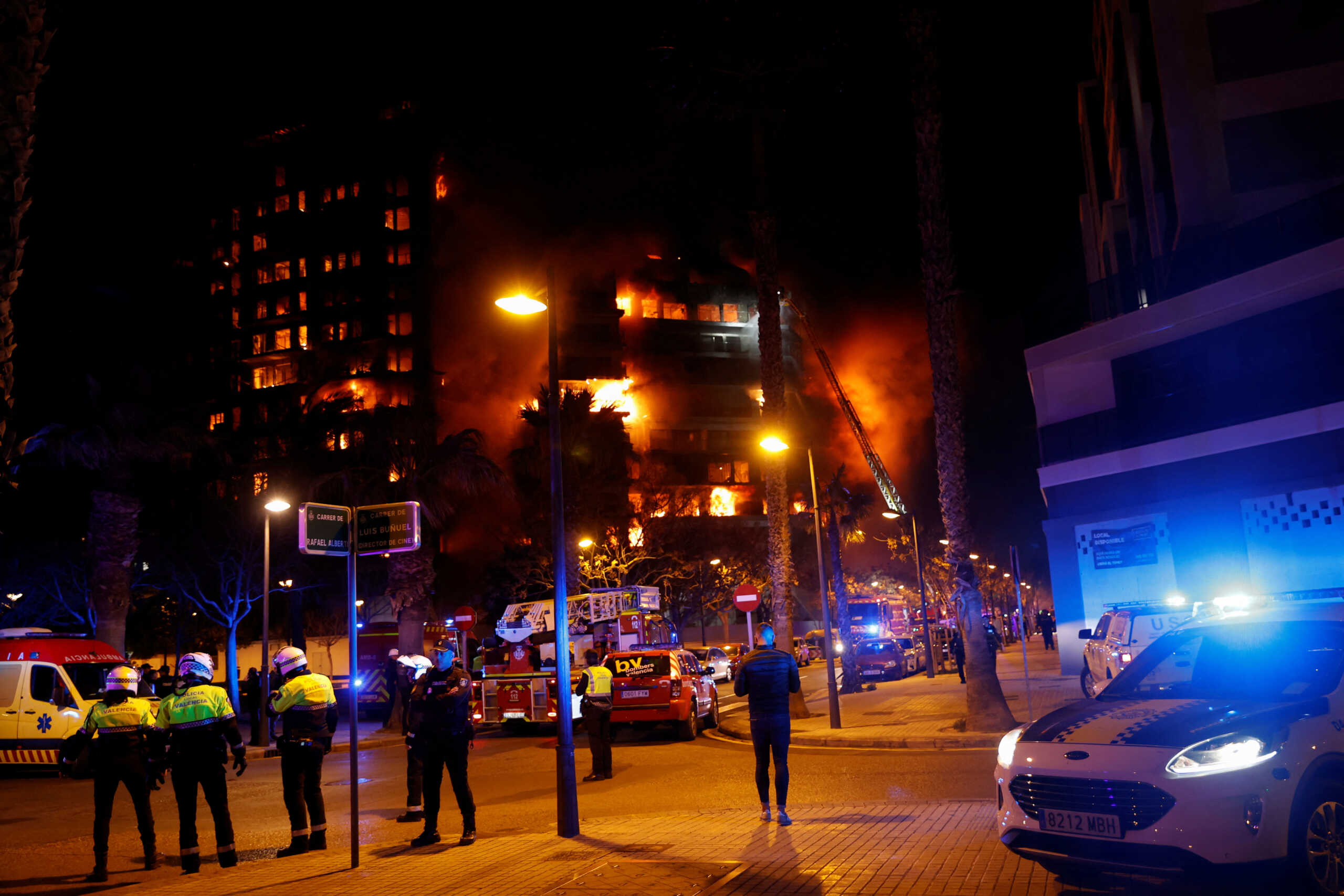 Police officers work at the scene of a fire of apartment building in Valencia, Spain February 22, 2024. REUTERS