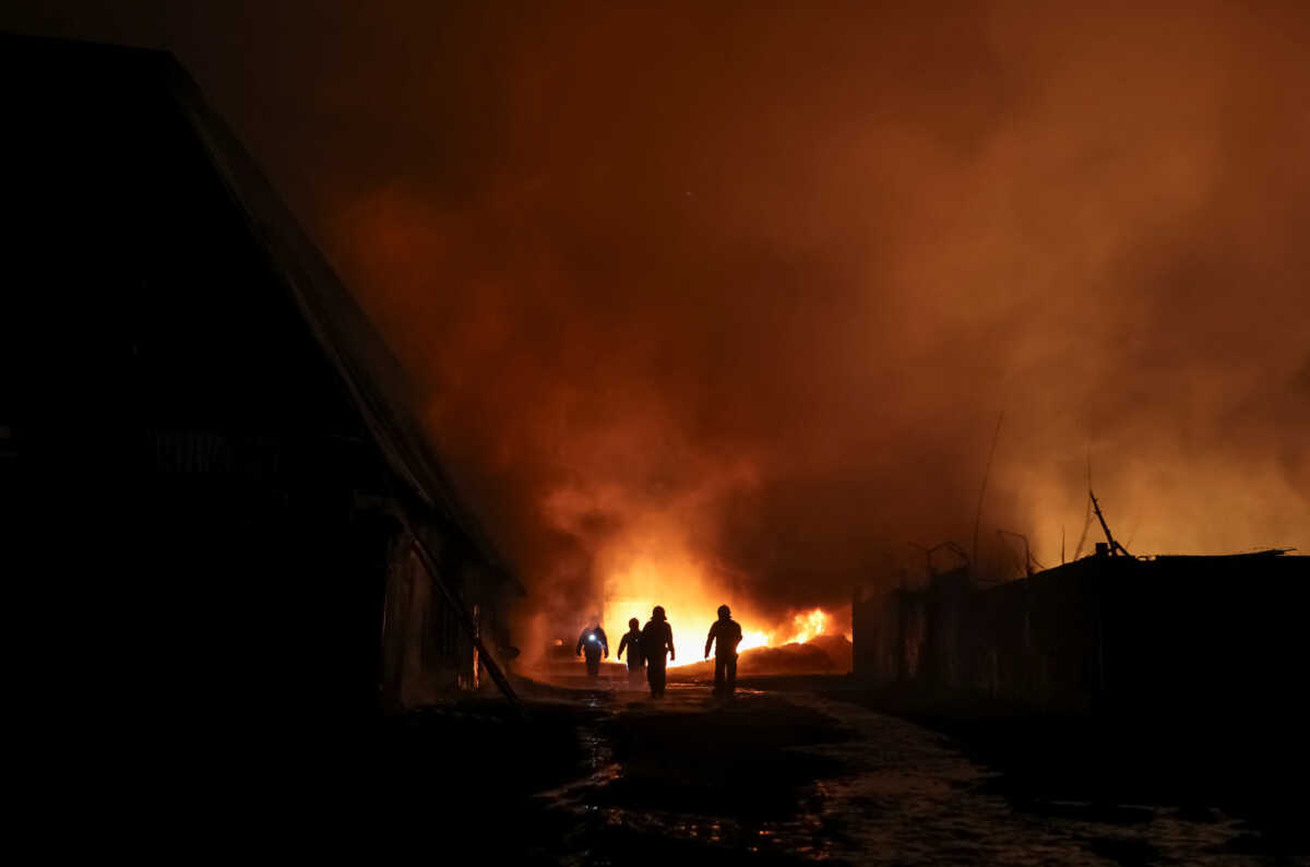 Firefighters work at the site of a Russian drone strike, amid Russia's attack on Ukraine, in Kharkiv, Ukraine February 10, 2024. REUTERS