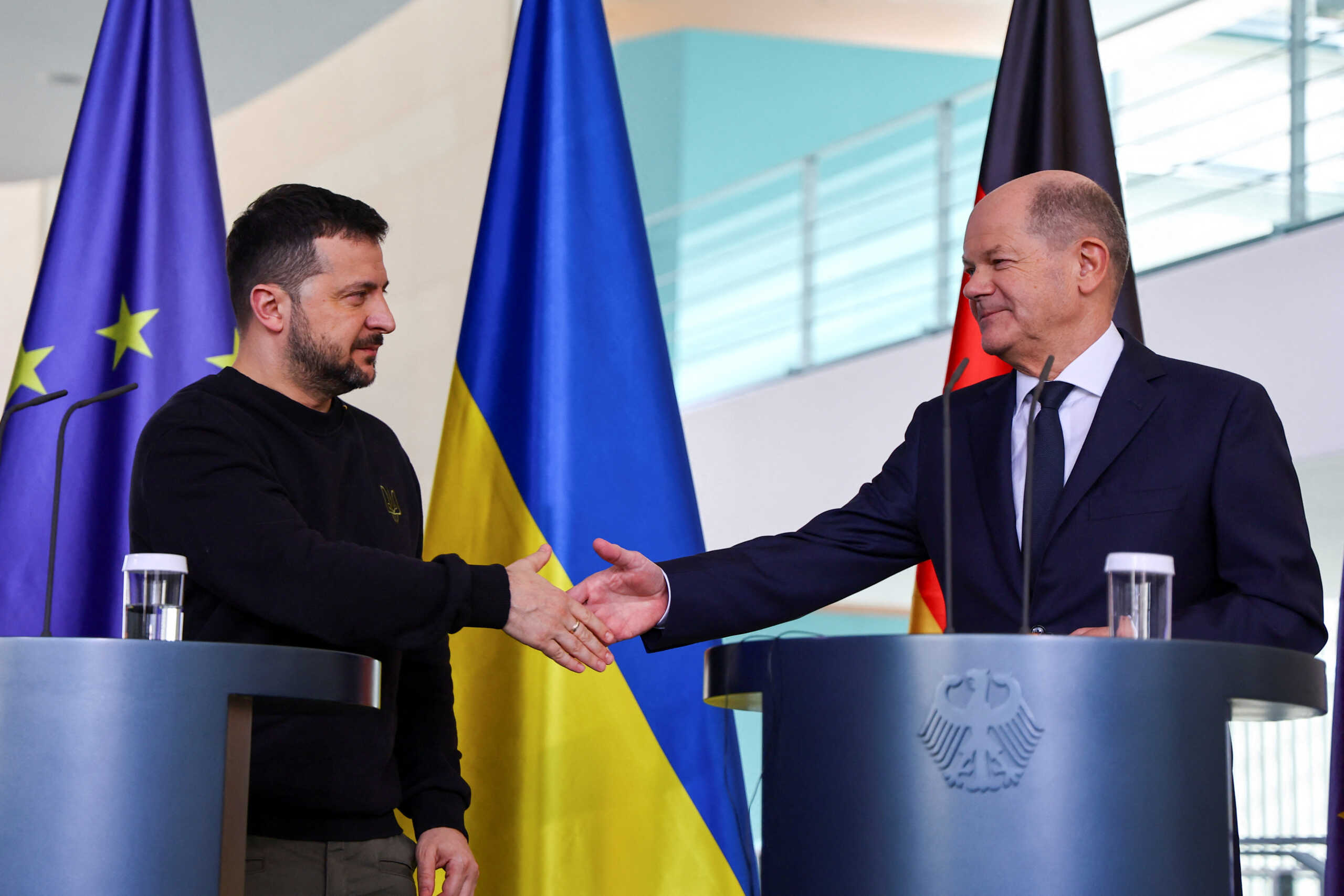 German Chancellor Olaf Scholz and Ukraine's President Volodymyr Zelenskiy shake hands at a press conference in Berlin, Germany, February 16, 2024. REUTERS