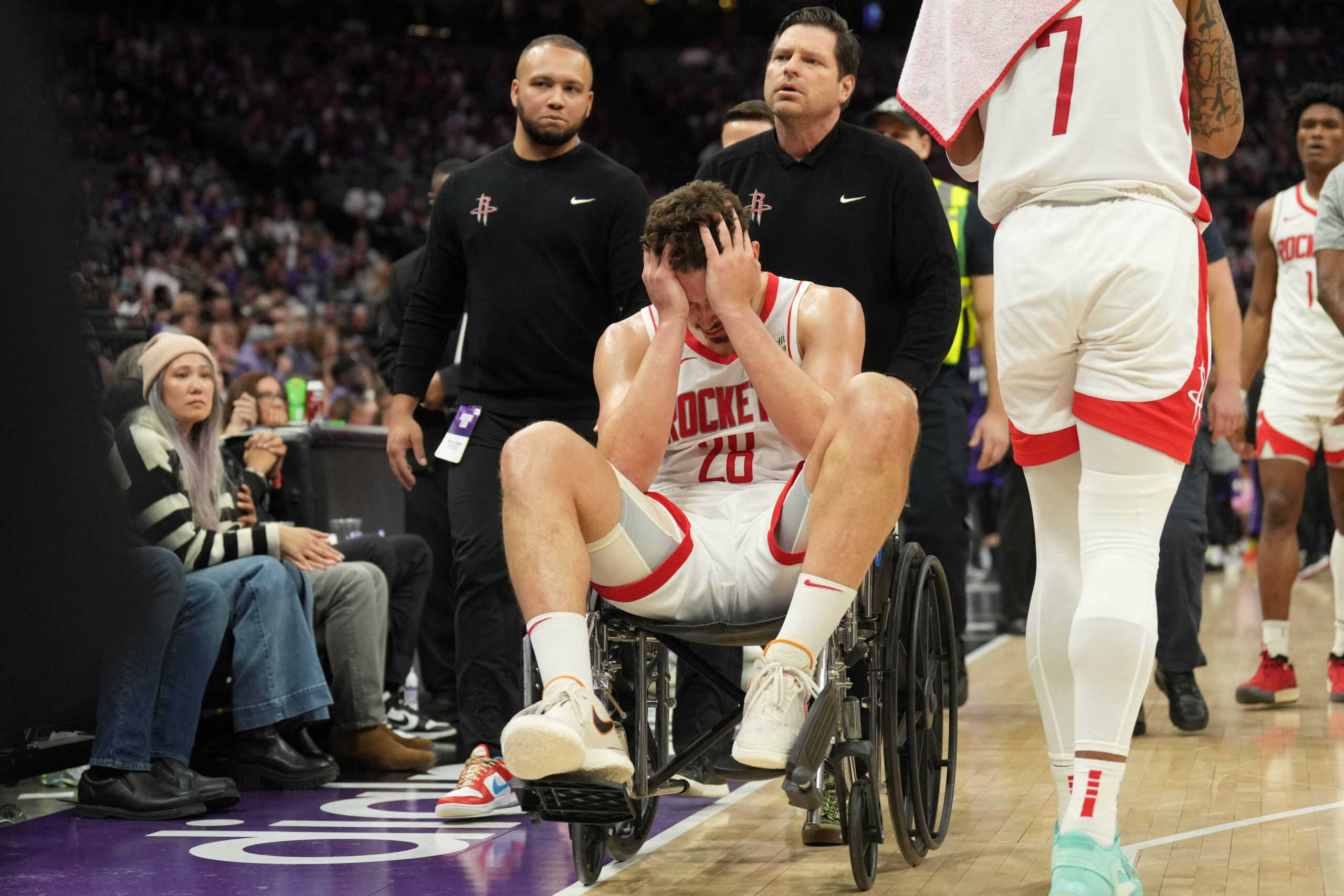 Mar 10, 2024; Sacramento, California, USA; Houston Rockets center Alperen Sengun (28) is wheeled off of the court after suffering an injury against the Sacramento Kings during the fourth quarter at Golden 1 Center. Mandatory Credit: Darren Yamashita-USA TODAY Sports