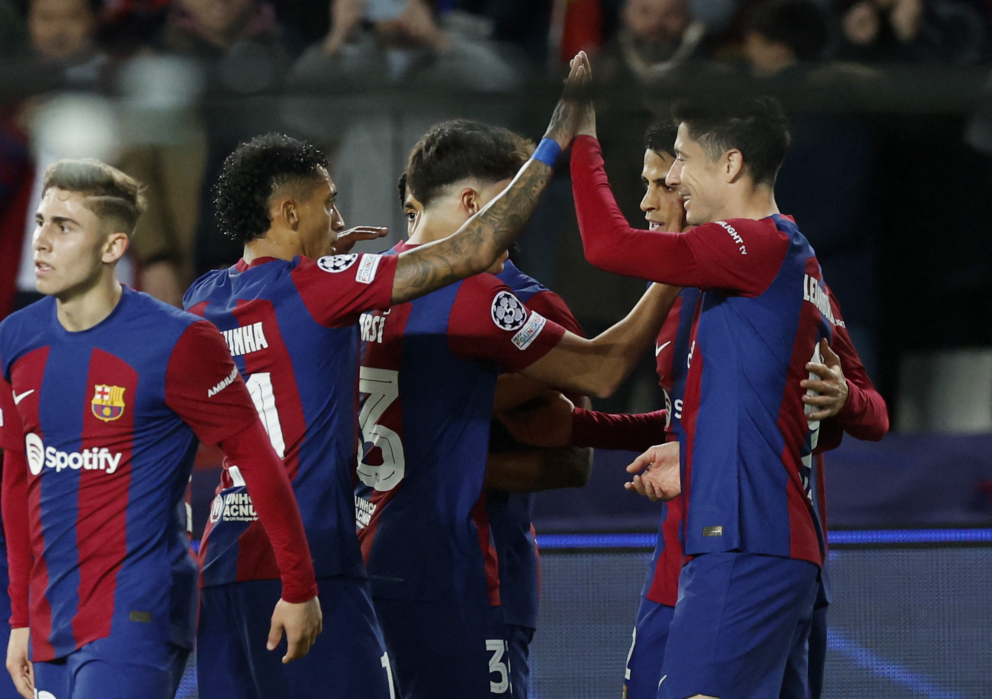 Soccer Football - Champions League - Round of 16 - Second Leg - FC Barcelona v Napoli - Estadi Olimpic Lluis Companys, Barcelona, Spain - March 12, 2024 FC Barcelona's Joao Cancelo celebrates scoring their second goal with teammates REUTERS