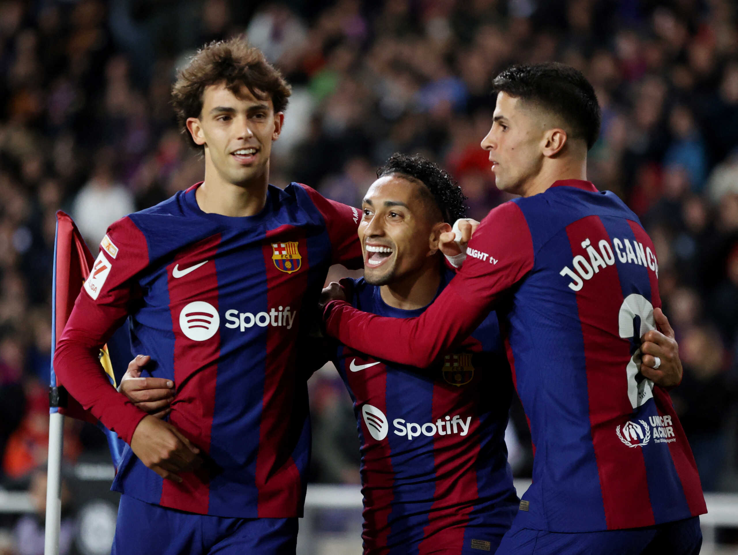 Soccer Football - LaLiga - FC Barcelona v Las Palmas - Estadi Olimpic Lluis Companys, Barcelona, Spain - March 30, 2024 FC Barcelona's Raphinha celebrates scoring their first goal with Joao Felix and Joao Cancelo REUTERS
