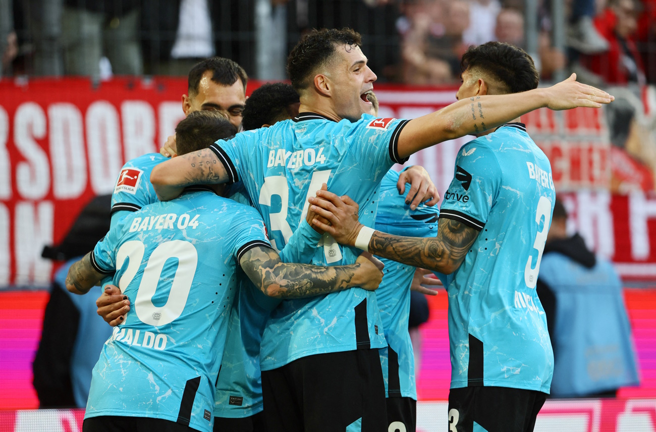 Soccer Football - Bundesliga - FC Cologne v Bayer Leverkusen - RheinEnergieStadion, Cologne, Germany - March 3, 2024 Bayer Leverkusen's Alejandro Grimaldo celebrates scoring their second goal with teammates REUTERS