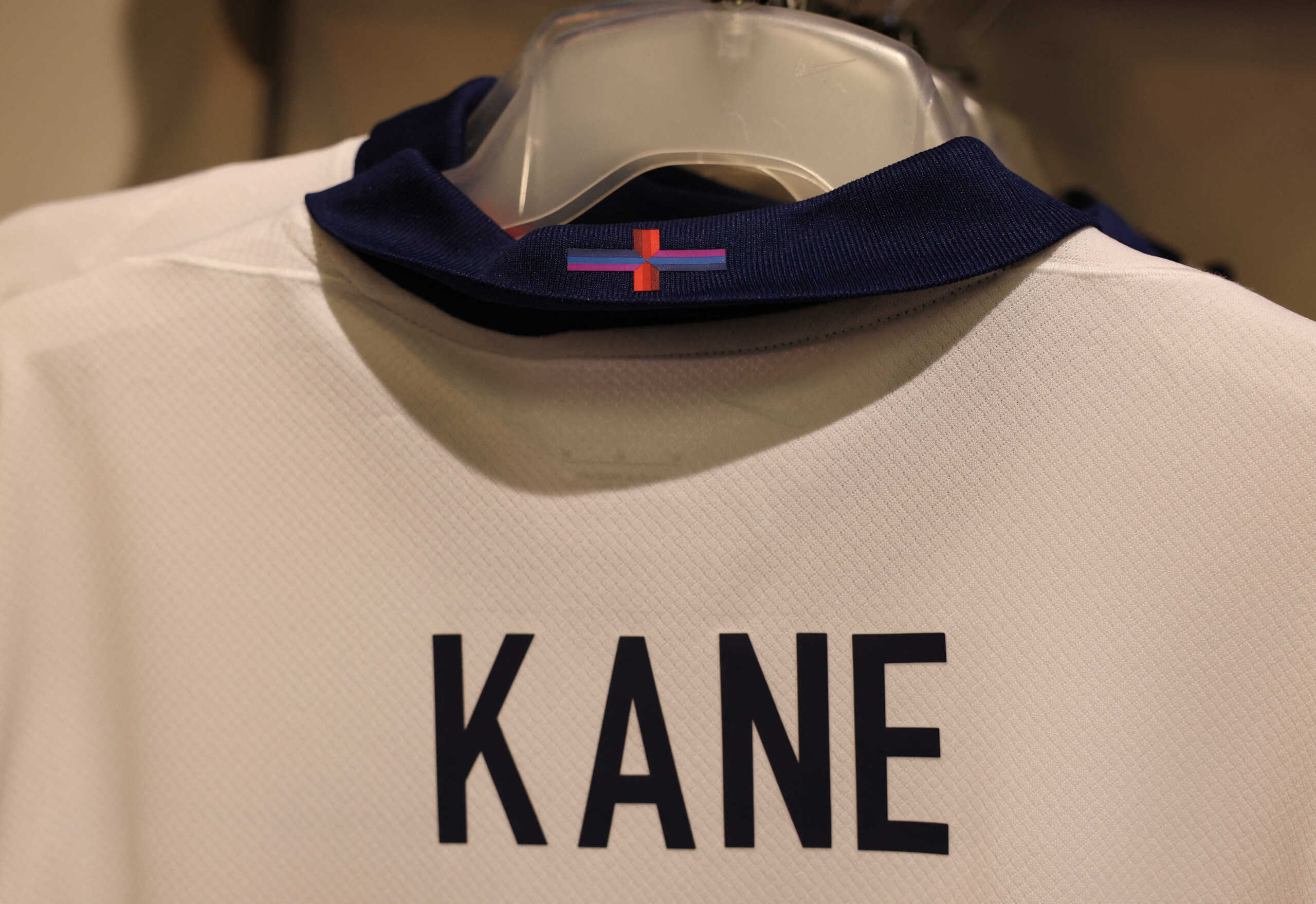 Soccer Football - A design of the St George's Cross is seen on a new England Harry Kane football shirt on display in the Wembley Stadium store in London, Britain - March 22, 2024 Action Images via Reuters